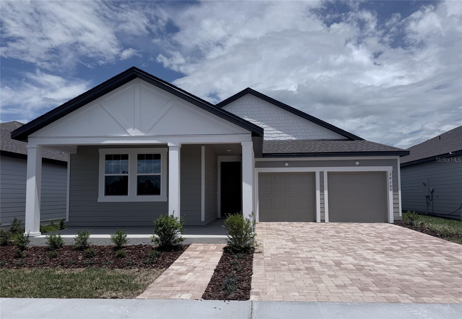 Under Construction. This thoughtfully designed home in the Trailside community features 4 bedrooms, 3 baths, and 2-car garage. The open floorplan offers abundant natural light and a seamless flow through the main living areas, which showcase beautiful wood-look luxury vinyl plank flooring. The kitchen is equipped with 42" cabinets, a large island with upgraded quartz countertops, and stainless steel appliances—perfect for everyday living and entertaining. Plush upgraded carpet adds comfort in the bedrooms, plus upgraded 8' interior doors are included throughout. The interior design selections feature the AW Collection Serena, bringing neutral and organic style throughout. Bring the outdoors in with a covered lanai just off the living area. Enjoy community amenities including a pool, clubhouse, and playground. Conveniently located near top-rated schools and the charming shops and restaurants of downtown Mt. Dora.
