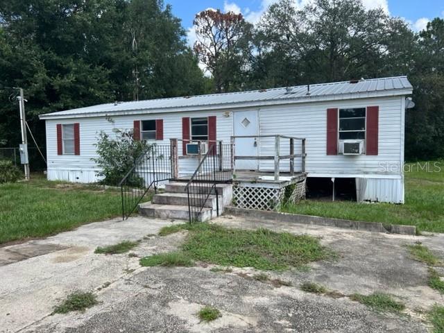 3 Bedroom and 2 bath manufactured home with 1,152 square feet on a large lot with a partially fenced yard with oversized storage shed. Home has a spacious living room, updated bathrooms, freshly painted walls, split floor plan, kitchen space with dining area, range and refrigerator. Home has Window A/C units. 1 small dog allowed only; with non-refundable pet fee. NO SMOKING. Schedule your tour today!