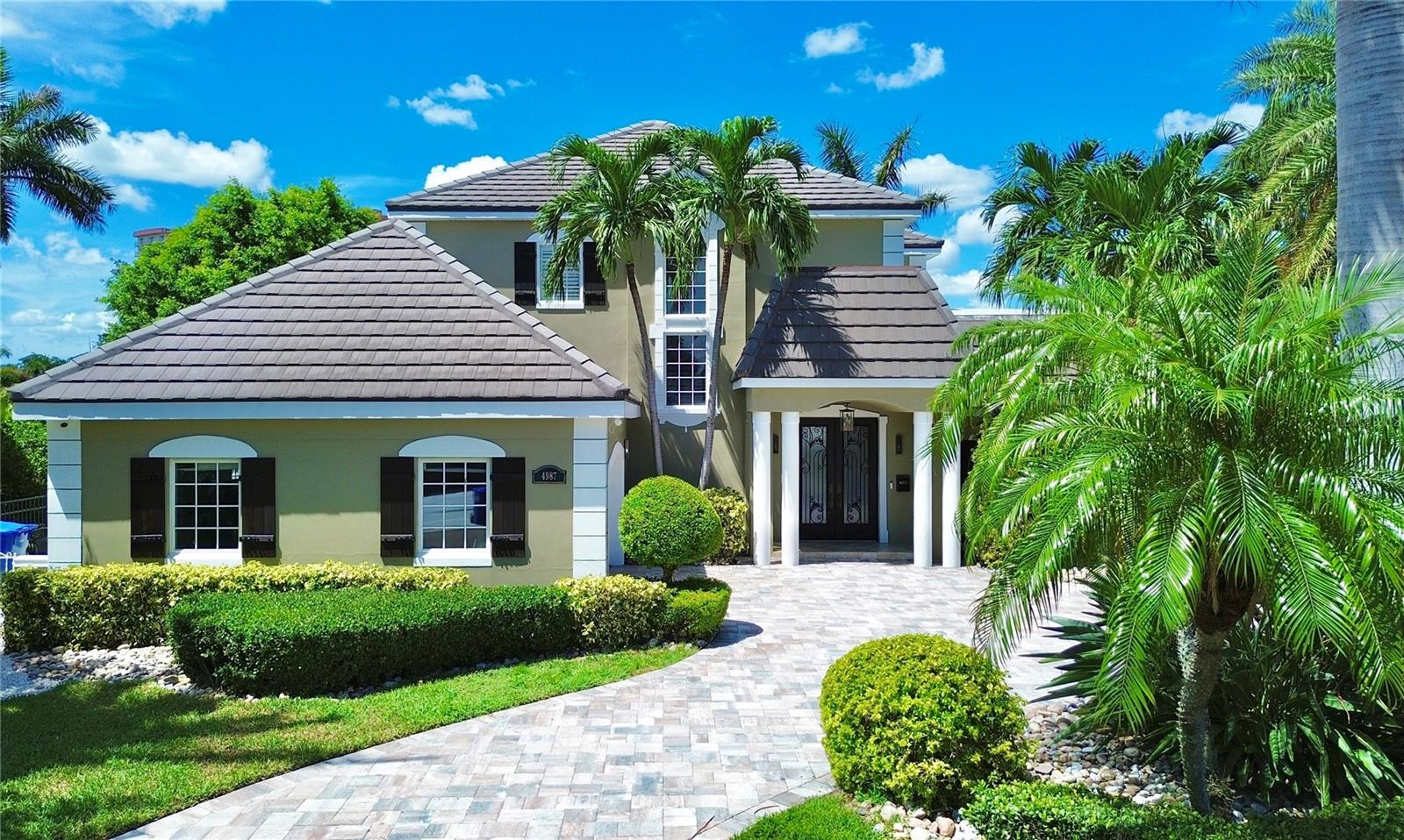 Motivated Seller! Indulge in the ultimate waterfront luxury with this exquisite 4-bedroom, 4-bathroom executive home situated within the esteemed Bayway Isle gated community. From the moment you enter, you'll be enchanted by the meticulous designer details that adorn every inch of this residence. The heart of the home is the impeccably designed kitchen, featuring custom cabinetry, high-end stainless steel appliances, double ovens, and a central island, all complemented by gleaming granite countertops. The main living level has been thoughtfully renovated with wide plank luxury vinyl flooring, updated bathrooms, and all-new lighting, creating a seamless blend of elegance and comfort. Upstairs, a grand primary suite awaits, boasting two walk-in closets, an ensuite bathroom with a large soaking tub, water closet with bidet, and a spacious walk-in shower, all with breathtaking water views. The entertainment options continue with a stunning theater room, perfect for movie nights and relaxation. Step outside to your private oasis, where a sparkling pool beckons you to unwind, and an outdoor kitchen allows for seamless alfresco dining amidst the serene waterfront backdrop. Boating enthusiasts will delight in the newer seawall, updated dock with trex decking, and two new boat lifts with capacities of 24,000lb and 7,000lb, providing effortless access to the open Gulf of Mexico. Bayway Isle is a boater's paradise, with no bridges obstructing the way to the open waters, making it ideal for sailboats. The landscape lighting adds a touch of magic to the outdoor space, while the low-maintenance grass turf ensures a pristine look year-round. Don't miss the chance to experience the ultimate waterfront lifestyle in this exceptional Bayway Isles home. Conveniently located between the vibrant mainland of St. Petersburg and the pristine beaches of St. Pete Beach, this is an opportunity to indulge in waterfront living at its finest. Schedule a showing today and prepare to be captivated by everything this property has to offer!