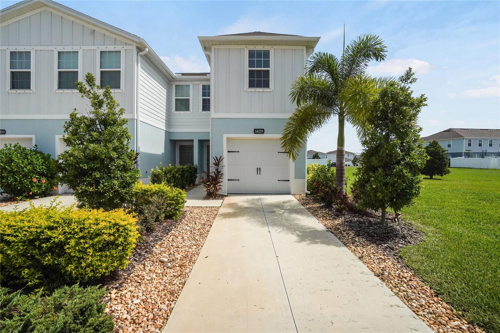 Welcome to 14229 Crimson Ave,  this beautifully maintained end-unit townhome with attached garage in the desirable Avalon Woods community of Lakewood Ranch! Enjoy an abundance of natural light thanks to its additional end-unit windows, this home combines style, comfort, and functionality. The open-concept floor plan features tile flooring throughout the main living areas, upgraded lighting, and a spacious kitchen complete with quartz countertops, extended cabinetry with elegant glass-front accents, a convenient corner pullout cabinet, and plenty of storage.
Upstairs, the spacious primary suite offers a walk-in closet and a private en-suite bath with a beautifully upgraded glass-enclosed shower. Additional cabinetry in every bathroom and faux wood blinds throughout add both style and convenience.
Step outside to your private, privacy-fenced yard with an extended paver patio—perfect for grilling, entertaining, or simply relaxing while enjoying the peaceful green space behind and next to the home. The attached one-car garage provides added security, convenience, and extra storage, making everyday living even more effortless. Additional features include a keyless entry system, built-in garage storage, and a 220-volt garage outlet ideal for an electric vehicle charger or generator hookup.
Avalon Woods is a charming, maintenance-friendly community with low HOA fees, a community dog park, play area, peaceful ponds and an excellent Lakewood Ranch location close to top-rated schools, shopping, dining, parks, golf, and everything the area has to offer. This move-in-ready home is the perfect combination of low-maintenance living and modern convenience.