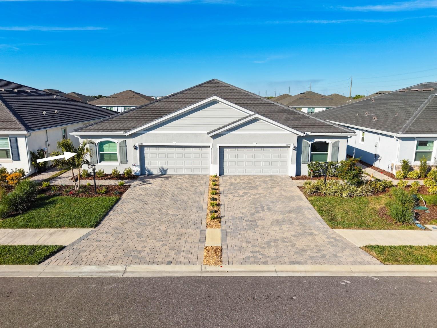 Welcome home ! This beautifully 2024 BUILT UPGRADED 3 BED, 2 BATH VILLA with a TILE ROOF and 2-car garage, located in the highly desirable STAR FARMS AT LAKEWOOD RANCH is ready for its new owners! This meticulously maintained home offers extensive upgrades throughout, creating a move-in ready Florida retreat.

Interior features include UPGRADED PAINT on walls and ceilings, PLANTATION SHUTTERS on all windows, CUSTOM HUNTER DOUGLAS ELECTRIC BLINDS on the sliders, upgraded ceiling fans, and leak detection monitoring devices under kitchen and bath sinks plus laundry area for added PEACE OF MIND.

Enjoy seamless indoor/outdoor living on the EXPANSIVE SCREENED IN LANAI with MARBLE TILE FLOORING, complete with electrical grounding in place for a future spa. The exterior showcases upgraded, extensive LANDSCAPING for your own personal oasis, and has professionally installed gutters specific to this floor plan.

The 2-car garage features INSULATION in both the garage attic and garage door for improved energy efficiency, along with grounding of the exterior electrical box for lightning surge protection. Additional thoughtful upgrades include an installed medicine cabinet in the primary bath, plus towel racks and toilet paper holders in both bathrooms. Built with CONCRETE BLOCK, a TILE ROOF, and equipped with HURRICANE SHUTTERS, this home has it ALL!

HOA fees include access to all resort-style amenities, gated entrances, and lawn care, offering true low-maintenance living. Community amenities feature a CLUBHOUSE, TIKI BAR / RESTAURANT, RESORT-STYLE POOLS (2), FITNESS CENTERS (2), PICKLEBALL COURTS, TENNIS COURTS, DOG PARKS, WALKING & BIKING TRAILS, AND SOCIAL EVENTS / GATHERING SPACES.

Ideally located near shopping and dining, University Town Center (UTC) Mall, Downtown Lakewood Ranch, Waterside at Lakewood Ranch, top-rated schools, medical facilities, and Sarasota’s beautiful Gulf beaches. A rare opportunity to own a villa loaded with upgrades that truly lives like a custom home.