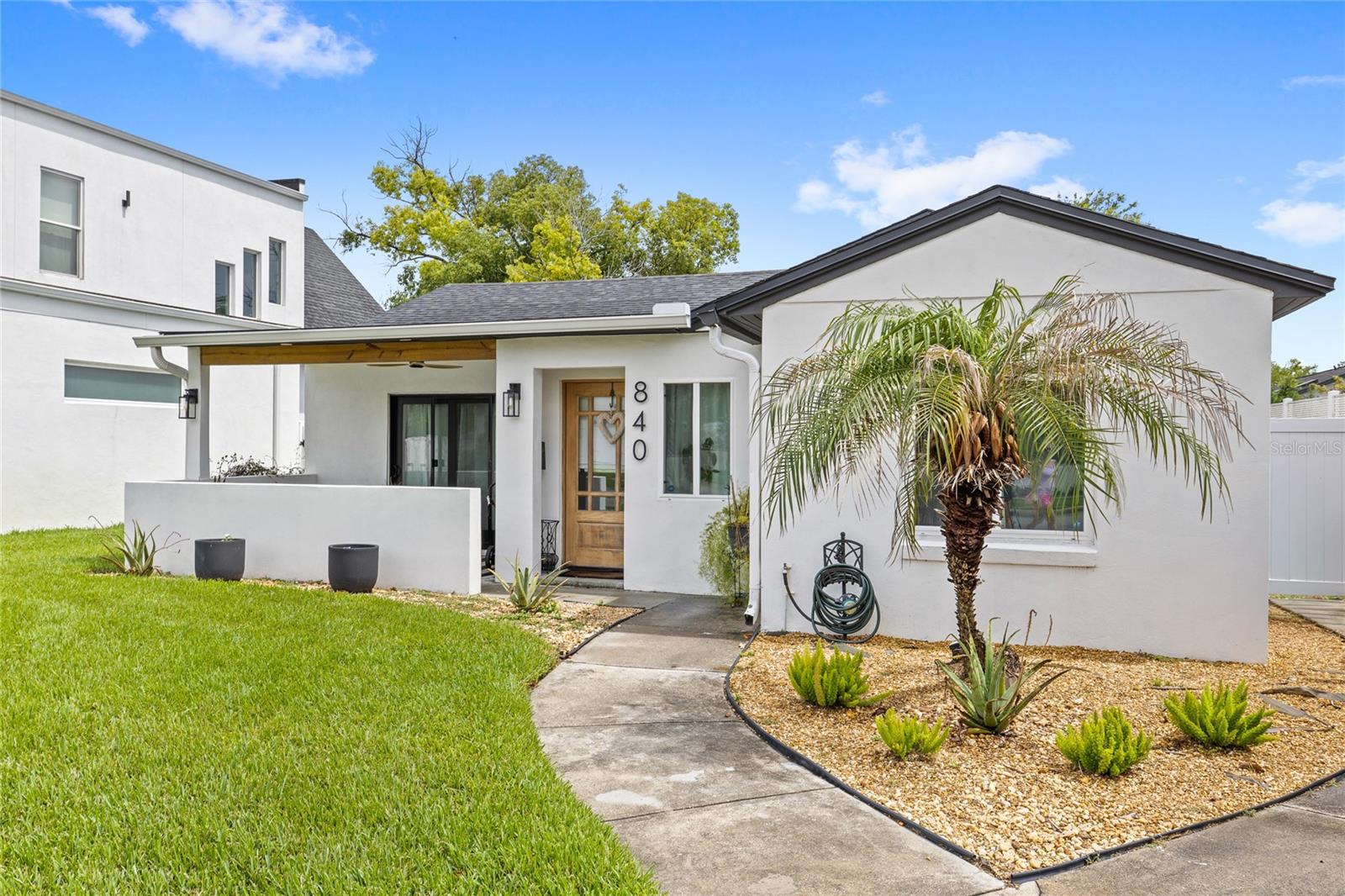 Fully renovated 2 bedroom and 2 bathroom home with a bonus room, ideally located in the heart of Winter Park. Every detail has been updated, including new mechanical systems, electrical, plumbing, custom doors and windows, gutters, stucco finishes, fixtures, fresh landscaping, and new sod. Inside, you'll find an open-concept floor plan with professionally installed luxury vinyl plank flooring (2026) backed by a transferable 10-year warranty. The designer kitchen features butcher block countertops, a farmhouse sink, tile backsplash, and premium stainless steel appliances, including a ZLINE 36" six-burner gas range, ZLINE dishwasher, and KitchenAid refrigerator. A spacious bonus room with vaulted ceilings offers flexible living space for a home office, gym, media room, or playroom.
The primary suite includes a spa-inspired bath with floor-to-ceiling porcelain tile, quartz vanity, touch-free LED mirror, and custom doors. Additional upgrades include copper plumbing already installed for a future tankless water heater.
Step outside to a fully fenced backyard with gates on both sides and a private patio perfect for entertaining.
Located just minutes from Winter Park Village, Park Avenue, Central Park, shopping, dining, entertainment, and Downtown Orlando, this low-maintenance Winter Park home offers exceptional rentability and walkability, and is situated in one of the area's most sought-after locations. Schedule your private showing today.
