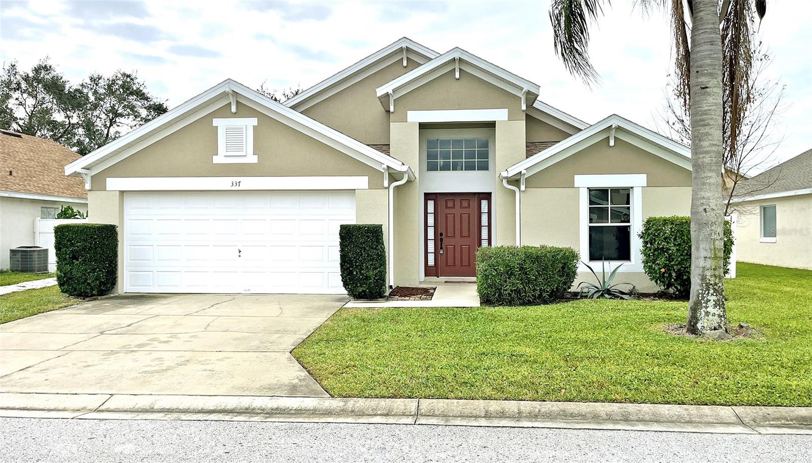 Welcome to 337 Silver Palms Circle, a well-maintained single-story home offering 3 bedrooms and 2 bathrooms within 1,582 square feet of living space. This home features a split floor plan with ceramic tile flooring throughout, providing both style and easy maintenance. The spacious kitchen boasts ample cabinet space, a double stainless steel sink, and plenty of room for all your culinary needs. The roof was replaced in early 2018, ensuring durability and peace of mind. The property includes a fenced-in rear yard offering privacy and a serene outdoor space, including a screened patio with ceiling fan and ceramic tile flooring extending your living area outdoors, perfect for relaxation or entertaining. Additional features include an indoor laundry room, a two-car attached garage, and higher ceilings throughout the home. Situated in a small, quiet community, this home is conveniently located near major attractions and shopping areas. The nearby Posner Park shopping center offers a variety of retail stores, dining options, and a movie theater for your convenience. Easy access to Interstate 4 and Highway 27 ensures smooth commutes to surrounding areas.
