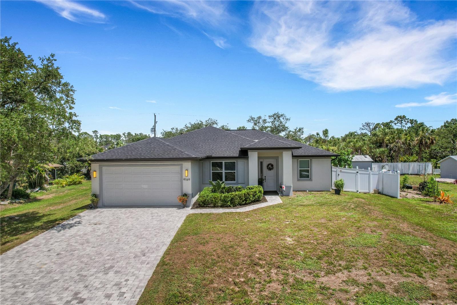 3 bedroom, 2 bath + den home built in 2022.  This home offers a split floor plan, spacious lanai, modern features, high ceilings with tile and laminate flooring, impact windows and luxury finishes. The kitchen features stainless steel appliances, modern fixtures and an oversized island. The main bedroom has a walk-in closet, dual vanities walk-in shower, and direct access to the covered back lanai. The den gives a flex space that can be used as a den, office, sitting area or a 4th bedroom. Covered lanai overlooking the backyard that is fully fenced.
