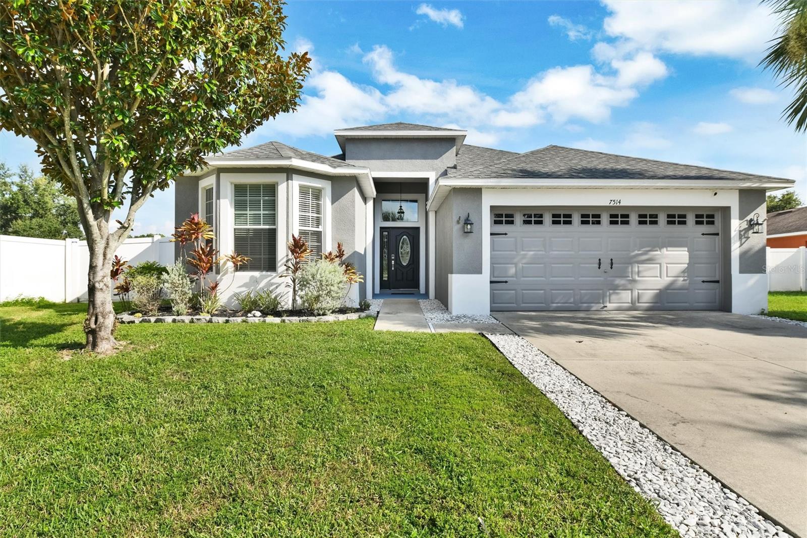 Welcome to this beautiful home in the resort style community of Summerwood at Oak Creek. This home is being offered fully furnished/turnkey. It is currently being enjoyed as a short term rental property.  It offers 3 bedrooms with a split floor plan, 2 full baths, and a two car garage. New roof 2025, HVAC just 3 years new. Tankless Water Heater. 12 to 14 ft ceilings. There are beautiful waterfront views from most of the living, dining area and the primary bedroom. When you enter into the foyer you will first notice the beautiful real wood flooring in the living areas and the view straight out to the water and conservation area. The back yard is completely fenced and there are no rear neighbors. The dining room has a pool table for guest entertainment. The kitchen has stainless steel appliances, granite counter tops, plenty of wood cabinets, lots of room and a dining table with a great view. The living area has a huge comfortable sofa, chair and large tv with huge double sliders to the back. Sit and enjoy the shade under the covered porch. The Owners Suite has tray ceiling, walk in closet with 10 ft ceilings. Spa-like bathroom features a soaking tub, glass enclosed shower with a sitting bench, dual granite vanities and a private water closet. The guest bedrooms are both a good size (11 x 11 and 11 x 16) with a shared bath. The bath has Granite counter tops, a tub/shower combo and a linen closet in the hallway. A list of additional features is provided. This home is clean, well maintained, fully furnished turn key and ready for you to enjoy. There is a beautiful resort like pool with a splash pad, several parks, a dog park close by, a gym and basketball court. Come and enjoy the Florida lifestyle with a water view and no flood insurance required!