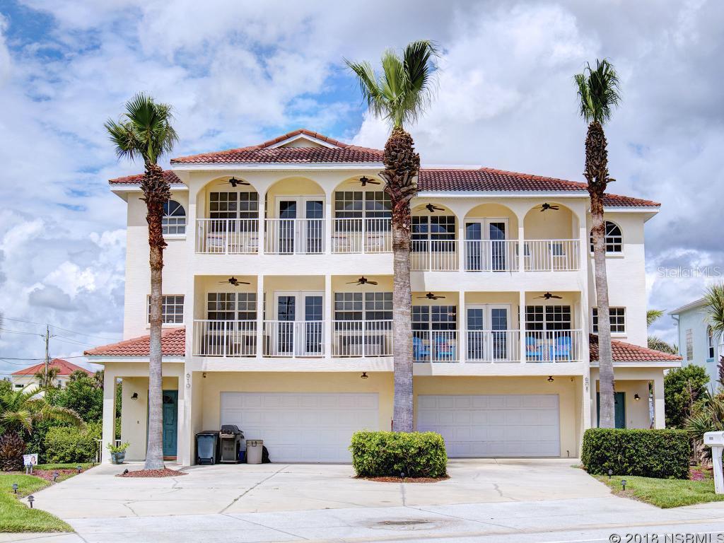 Welcome to Paradise!  This immaculate low maintenance 3 story, 3 Bed 3.5 Bath luxury residence offers incredible ocean views from either the second or third floor balconies. Brightened by natural light on all 3 floors, the first floor features a comfortable living space and full bath and French doors open up to the crystal blue waters of the heated pool and hot tub. The heart of this home is its second floor living area where the large kitchen featuring a built in wine cooler, Stainless Steel appliances, and beautiful white granite breakfast bar adjoins with the living room.  This spacious living space maintains a cozy atmosphere with its gas fireplace, warm burnt pine wood floors, and elegant French doors which lead out to the balcony and views of the Atlantic.  From the private balcony of the 3 floor master suite, you can wake up to more views of the ocean.  2 additional bedrooms, laundry, and guest bath which are also located on the 3rd. floor. Other features include 2 car garage, and the condo association manages all exterior maintenance, pool, yard, pest control, etc. All conveniently located just 5 blocks south of shopping and NSBâs amazing dining on entertaining Flagler Ave. and directly across the street for the beach! ;LocationDescription: Condo ;Water: City