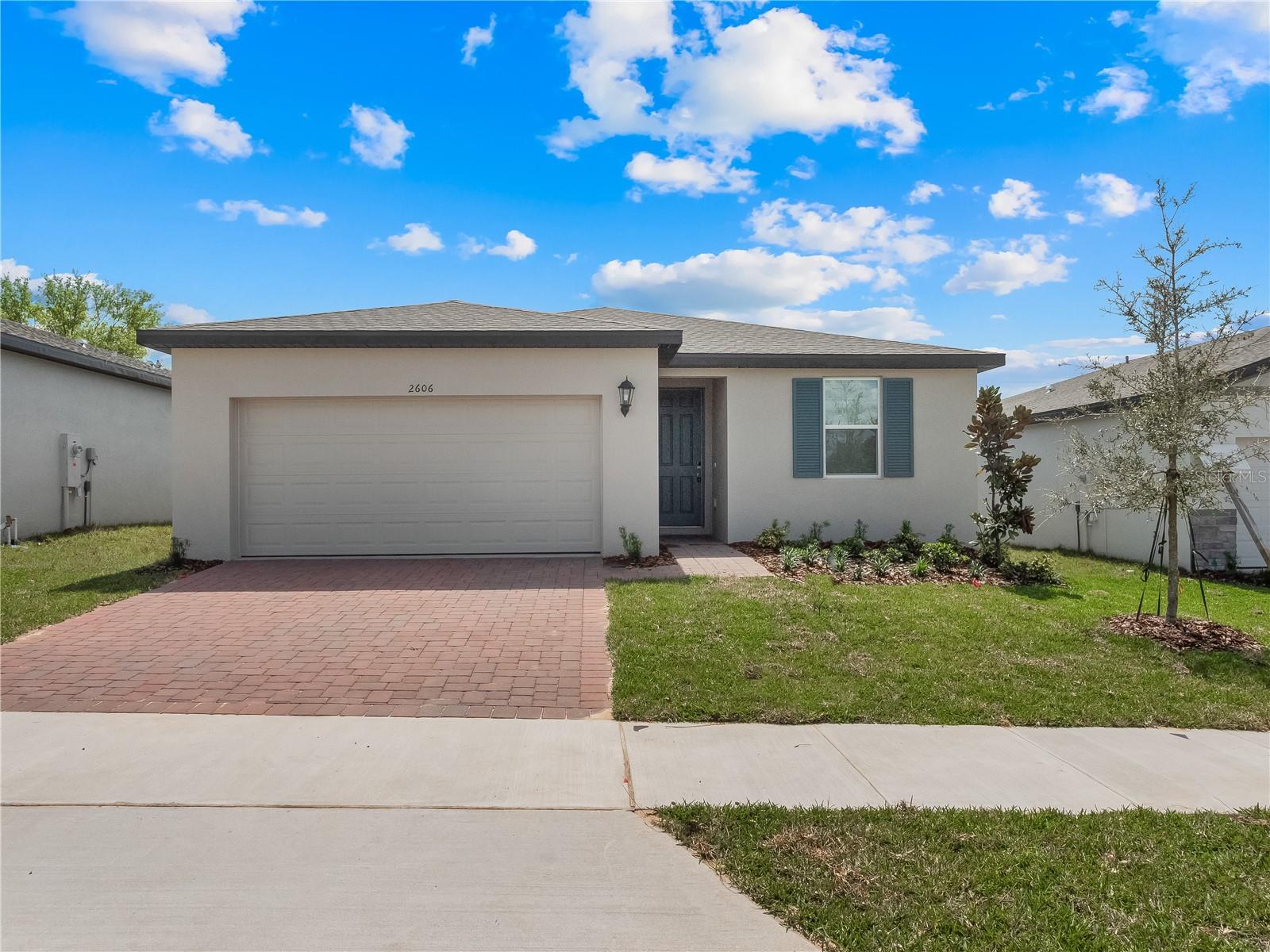 ThiS 3 bedroom 2 bathroom home boasts almosT 1700 sq ft of living space and is available for immediate move in. There is also a large den area that can be used as a home office, 2nd seating area or playroom. As you enter the home you will love that everything is new and ready for immediate move in. There are tiles throughout the whole house except for the bedrooms. The kitchen is modern with white shaker style cabinets, granite counter tops and stainless steel appliances. There is large island which can also be used as an eating area. There is plenty of cabinets and a closet pantry. The home has an open floor plan with plenty of natural lights and blinds on all the windows. The master bedroom is a great size with a huge walk in closet and ensuite bathroom. The bathroom is spacious with a double vanity with granite counter tops, his and her sinks and a walk in shower with glass doors. The 2nd bathroom has a tub with overhead shower and single vanity. The house comes with a laundry room, ( washer and dryer included) and a 2 car garage with automatic opener. The home is located close to the post office in Davenport and just a short distance from Haines City.