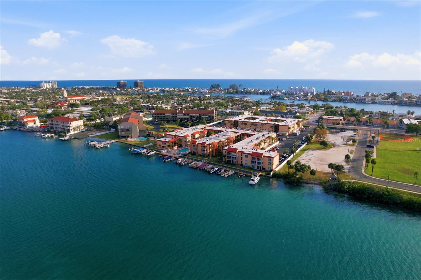 WATER AT YOUR DOORSTEP — WAKE UP TO THIS EVERY DAY. Picture your morning coffee in a private sun room that sits right at the water's edge, watching boats glide by on the Intracoastal from your own front-row seat. This isn't a "partial view" or a "peek of the water" — this is unobstructed, straight-down-the-dock, watch-the-dolphins-swim-by waterfront living, and it's rare to find at this price point.
Welcome to Boca Shores, one of St. Pete Beach's most beloved gated waterfront communities — and this fully remodeled first-floor 1-bedroom, 1-bath condo is the one buyers wait for. What sets this unit apart from the rest of the building is the bonus sun room, positioned right in front of the fishing dock, giving you unobstructed intracoastal views you simply won't find in a standard unit here.
Currently vacant and move-in ready, this home has been beautifully renovated from top to bottom — new impact-rated windows, doors, and sliders, an updated kitchen with quartz counters and stainless appliances, tile flooring throughout, and all the big-ticket mechanicals already handled. Just bring your suitcase.
Step outside your door and you're steps from the fishing dock, the waterfront pool, and the kayak launch. Boat slip leases are available for those who want to keep their vessel just steps from home. The HOA covers building insurance, exterior maintenance, cable, internet, water, sewer, and trash — ownership here is refreshingly simple.
Boca Shores is known for its friendly, social atmosphere — sunset happy hours on the deck, holiday parties, and neighbors who become lifelong friends. You're minutes from the white sand of St. Pete Beach and Pass-a-Grille, with downtown St. Petersburg, Gulfport, and both Tampa and St. Pete/Clearwater airports all within easy reach.
Motivated seller offering owner financing — a rare opportunity to make waterfront living attainable. Don't just read about it — see the photos, then come stand in that sun room yourself. Schedule your private showing today; homes like this at Boca Shores don't last.