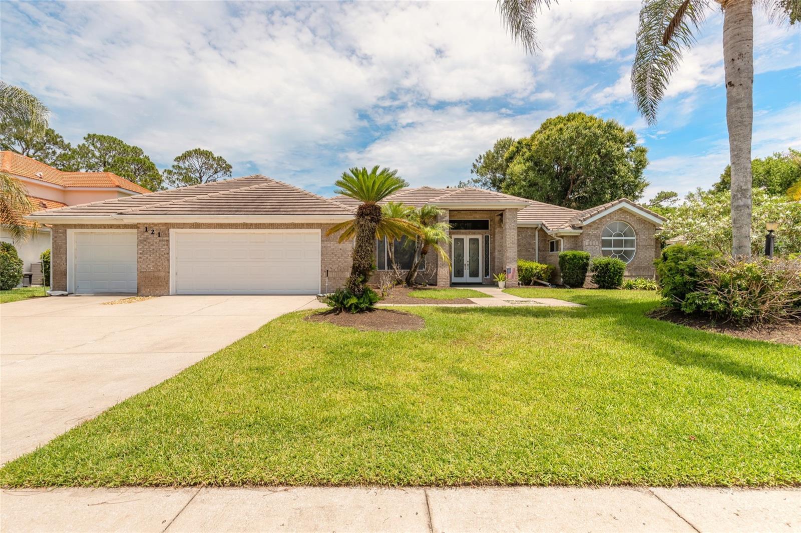POOL HOME IN PELICAN BAY'S PRESTIGIOUS ESTATES SECTION! Daytona Beach, Florida
Experience the perfect blend of luxury, comfort, and Florida living in this beautifully updated 4-bedroom, 3-full-bath brick pool home located within the desirable guard-gated community of Pelican Bay. From the moment you step inside, you'll be captivated by the soaring 12-foot ceilings, open-concept design, elegant tray ceilings, crown molding, decorative art niches, and abundant natural light.
The heart of the home is the stunning, chef-inspired kitchen, featuring rich cherry-wood cabinetry, granite countertops, stainless-steel appliances, and ample space for entertaining family and friends. The seamless flow between indoor and outdoor living areas makes this home ideal for gatherings year-round.
Retreat to the spacious primary suite with direct access to the pool deck, a spa-like bath with a soaking tub, walk-in shower, dual vanities, and an oversized walk-in closet. The split-bedroom floor plan provides privacy and flexibility for family, guests, or a home office.
Step outside to your private backyard oasis featuring a screened pool and a fenced area perfect for pets or play. Whether you're hosting guests or enjoying a quiet evening at home, this outdoor space is designed for relaxation and enjoyment.
Located within Pelican Bay's sought-after guard-gated community, residents enjoy security, mature landscaping, golf course surroundings, and an exceptionally affordable HOA fee. The convenient central location places you just minutes from I-95, I-4, Daytona Beach International Airport, Port Orange Pavilion, shopping, dining, medical facilities, and only 15 minutes from the World's Most Famous Beach.
Move-in ready and meticulously maintained, this exceptional brick home offers the lifestyle you've been searching for—privacy, security, luxury, and convenience all in one package. See the documents section for a complete list of upgrades and improvements. All Measurements are approximate