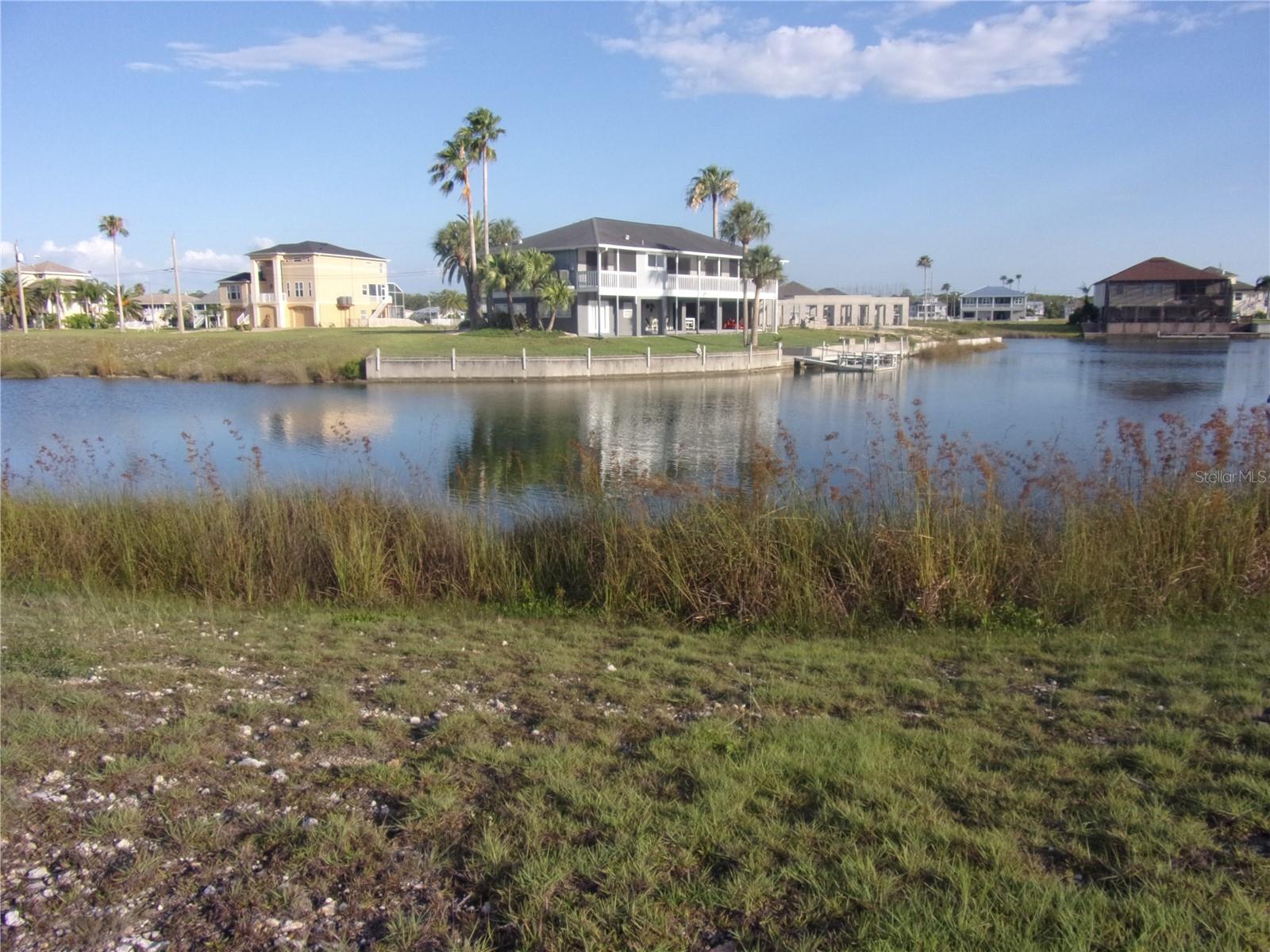 Build Your Waterfront Dream – Cleared Canal Lot in Hernando Beach!
Discover the perfect opportunity to build your custom coastal retreat on this cleared, build-ready lot located on a wide canal in Hernando Beach, Florida. Situated in a serene, waterfront neighborhood, this lot offers direct canal access and is just minutes from the Gulf of Mexico via the nearby community boat ramp.
Enjoy peace of mind with a fire hydrant conveniently located on the east side of the property, and take advantage of the proximity to local marinas, giving you multiple options for boat storage and maintenance.
Property Highlights:
• Cleared, level canal-front lot – ready for construction
• Fire hydrant on east side of lot (ideal for insurance and safety)
• Direct Gulf access via canal and community boat ramp
• Marinas nearby for added boating convenience
• Utilities available at the street
• Located in a coastal community with waterfront dining, parks, and nature preserves nearby
• Enjoy fishing, kayaking, and boating right from your backyard, or take a short ride out to the open Gulf for world-class fishing and diving. Minutes from local restaurants, parks, Weeki Wachee Springs, and U.S. 19 for easy access to shopping and Tampa-area amenities.
• This is more than just a lot—it’s the start of your coastal lifestyle. Come see it today and start planning your dream home!
Elevated construction required.