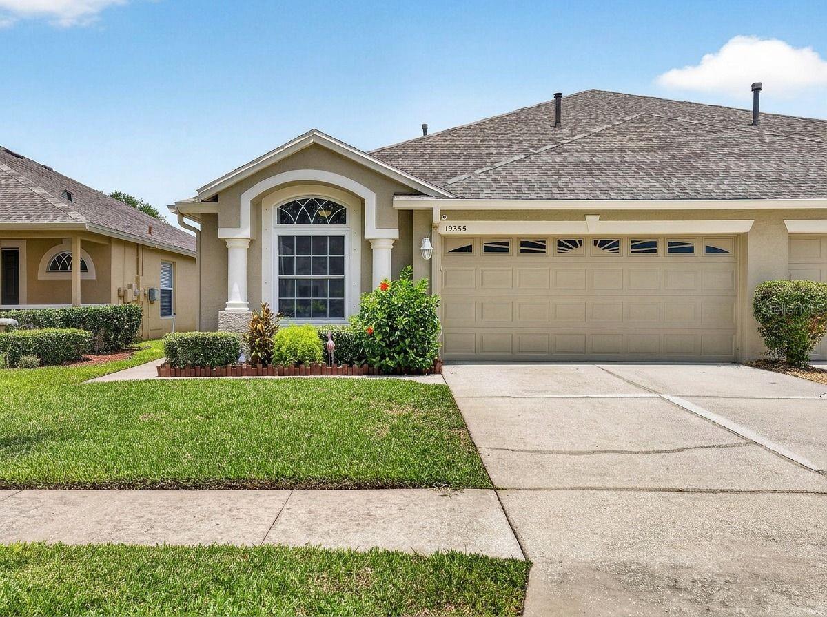 Florida carefree living at its finest! Welcome to this meticulously maintained, maintenance-free 1,704 sf villa (2 BED +2 BATH + DEN +2 CAR GARAGE) in the gated community of Weymouth within Oakstead. From the moment you walk in, the pride of ownership shows. Neutral paint, 10-ft ceilings, crown molding and chair rails carry through most of the home. The extra room is a versatile office/den/study with double glass doors (no closet) — add a curtain and a wardrobe cabinet for an easy guest room or child's room. The two full bedrooms sit on opposite ends of the home for added privacy, and the secondary bedroom features custom closets, added in 2024. The open living/dining space flows into the kitchen and out to a screened lanai with paver patio and fenced backyard — perfect for Florida indoor-outdoor living and privacy. The kitchen was updated in 2024 with quartz countertops and features professionally painted cabinets also in 2024, a closet pantry, breakfast bar, and newer stainless steel appliances, including a natural gas range with convection oven. The laundry closet includes a gas dryer. The primary suite offers a spacious bedroom and ensuite bath with dual sinks, walk-in closet, and walk-in shower.  Recent updates: HURRICANE IMPACT WINDOWS (2024), QUARTZ KITCHEN COUNTERTOPS (2024), CUSTOM CLOSET in secondary bedroom (2024), GUTTERS replaced (2022), A/C replaced (2015), ROOF replaced (2016). Oakstead is a master-planned community close to A-rated schools, Tampa Premium Outlets, The Groves, Trinity's growing retail and dining scene, major medical facilities, and easy highway access. HOA dues cover roof replacement (per HOA schedule), lawn care, and exterior maintenance and painting. Community amenities include a clubhouse with two pools, fitness center, tennis and pickleball courts, basketball courts, a nature trail, and a large open field for soccer and recreation.
Make your appointment today!