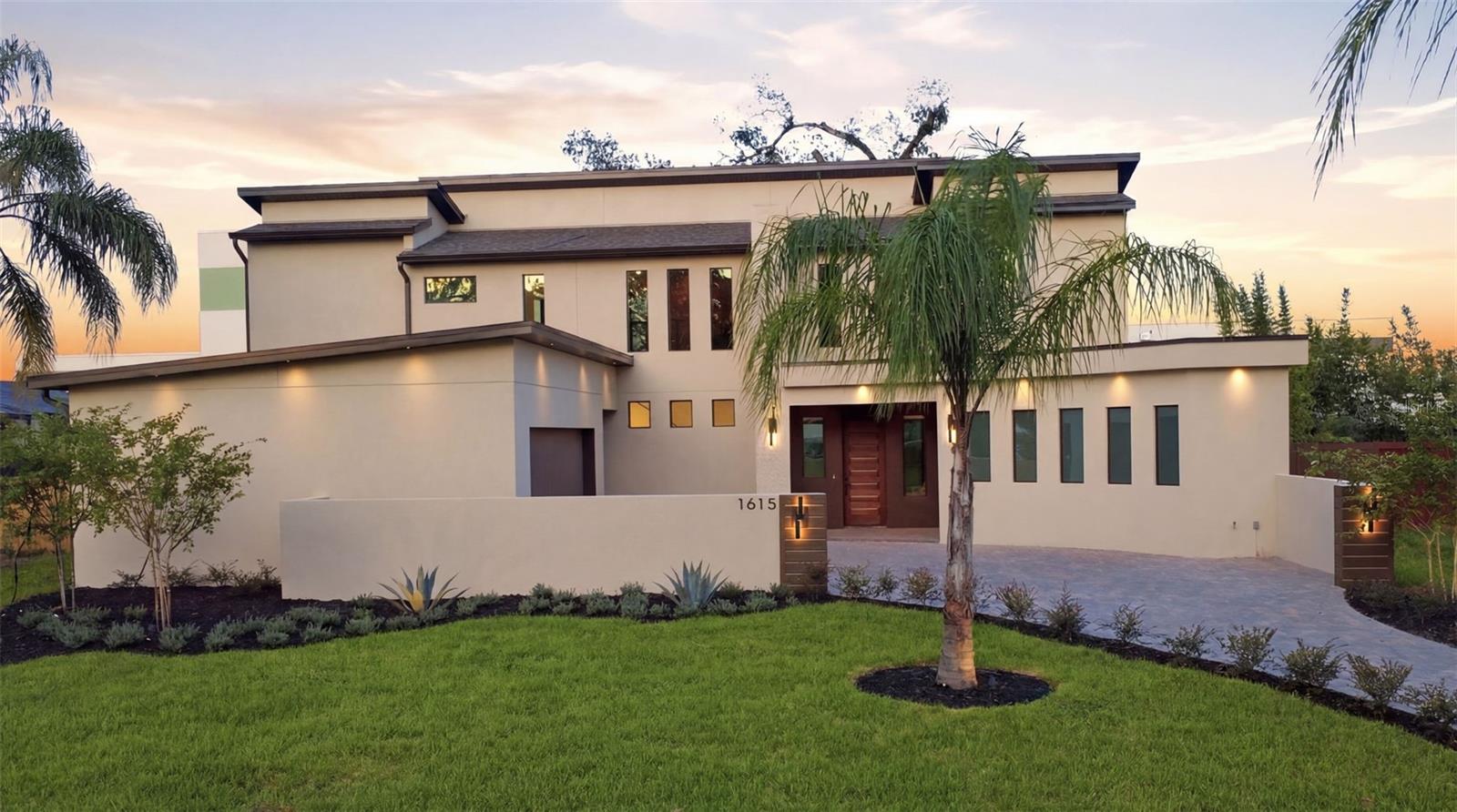 Immerse yourself in this stunning new construction home by Innate Modern, perfectly situated in the heart of Audubon Park. Offering five bedrooms, three-and-a-half bathrooms, and more than 2,800 square feet of thoughtfully designed living space, every detail has been carefully curated to blend modern style with everyday comfort. The open-concept floor plan centers around a beautifully appointed kitchen featuring rich wood accents, designer lighting, and premium finishes that seamlessly flow into the spacious living and dining areas—ideal for entertaining or relaxing with family. The first-floor primary suite serves as a private retreat, complete with a spa-inspired bathroom, generous walk-in closet, and an abundance of natural light streaming through a dramatic series of frosted windows spanning the length of the wall. Upstairs, a spacious loft offers flexible living space perfect for a media room, home office, or playroom. Three additional bedrooms complete the second level, including one with its own private en-suite bathroom, while two others share a convenient Jack-and-Jill bath.
Step outside to enjoy a charming brick patio overlooking an expansive backyard, offering plenty of room for outdoor entertaining, gardening, or future customization. Located just moments from Corrine Drive, East End Market, Baldwin Park, Winter Park, and Downtown Orlando, this home places you at the center of one of Orlando’s most sought-after lifestyle districts. Enjoy walking to local coffee shops, acclaimed restaurants, parks, and neighborhood favorites like Gideon’s Bakehouse, all while experiencing the privacy and tranquility of a quiet residential street.  Zoned for the highly desirable Audubon Park K–8 School and Winter Park High School, 1615 Cole Road offers the perfect combination of contemporary design, functional living, and an unbeatable location in one of Orlando’s most beloved neighborhoods.
