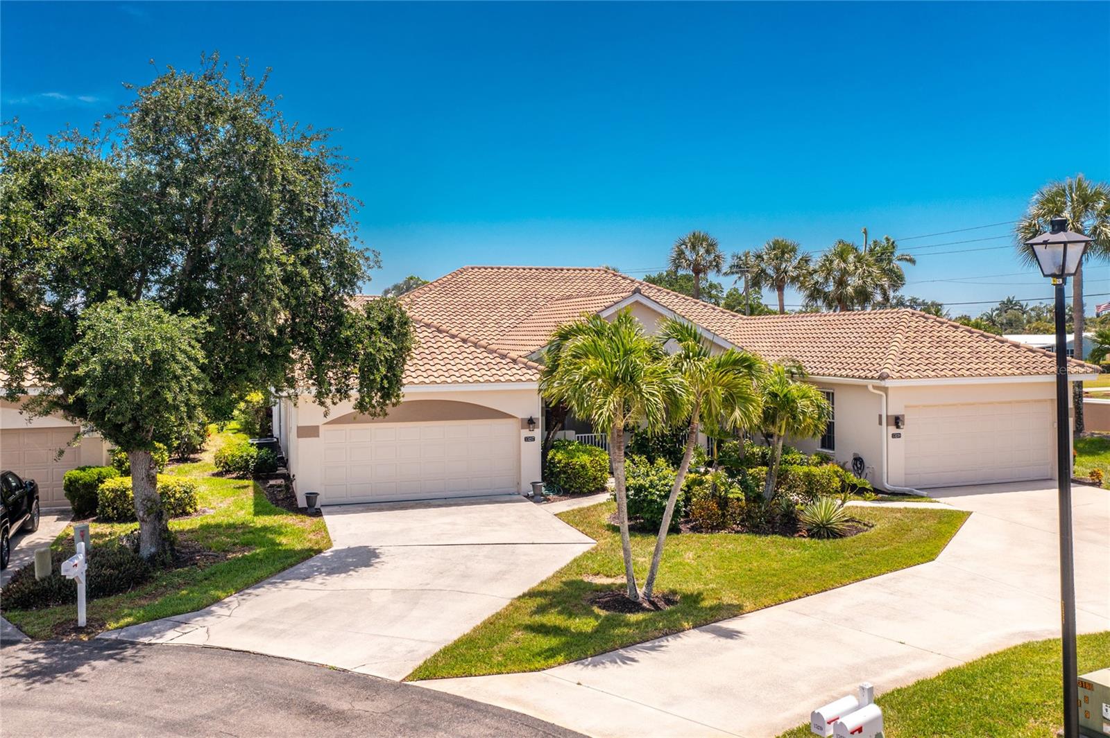Impressive **FURNISHED** attached villa located at desirable Waters Edge Two at Peppertree Pointe, a private gated community along the Caloosahatchee River just minutes from the Gulf of Mexico. This light and bright villa offers 3 Bedrooms, 2 full bathrooms and 2 Car Garage. There is an open and split bedroom floor plan with Great Room, Dining Area, well appointed Kitchen, Inside Utility and spacious 422 SF enclosed rear porch. Foyer with diagonal lay tile leads to the spacious Great Room with high grade wood floor and crown molding and has pocket sliding glass doors to the enclosed porch. There is a Dining Room and Den- also with wood flooring- off of the Great Room. The large eat in Kitchen features white cabinetry, granite counters, tile backsplash, pantry closet, double sink and stainless appliances: French door refrigerator, dishwasher, oven/range and microwave. The laundry closet has a stacked washer and dryer. The master bedroom suite offers a tray ceiling, walk in closet and private bathroom with dual sinks, vanity, garden tub, separate walk in shower and bidet. There are two additional bedrooms with good sized closets and one bedroom offers access to the lanai. French doors lead to the third bedroom with closet which is currently being used as an office. The guest bathroom has a tub/shower combo. Other features include hurricane shutters, courtyard entry, rain gutters, crown molding, tray ceiling,  ceiling fans, tile roof, front door with transom window and sidelights, large windows. high grade wood flooring throughout- new within the last year. New air conditioner within the past year. New roof within the past 2 years. The villa is beautifully furnished. Waters Edge Two is a gated community with 2 community pools, tennis courts, pickleball courts, private marina with wet and dry slips available for lease, a boat launch, private beach, trailer storage and pavilion area. This is a wonderful home in a great community!