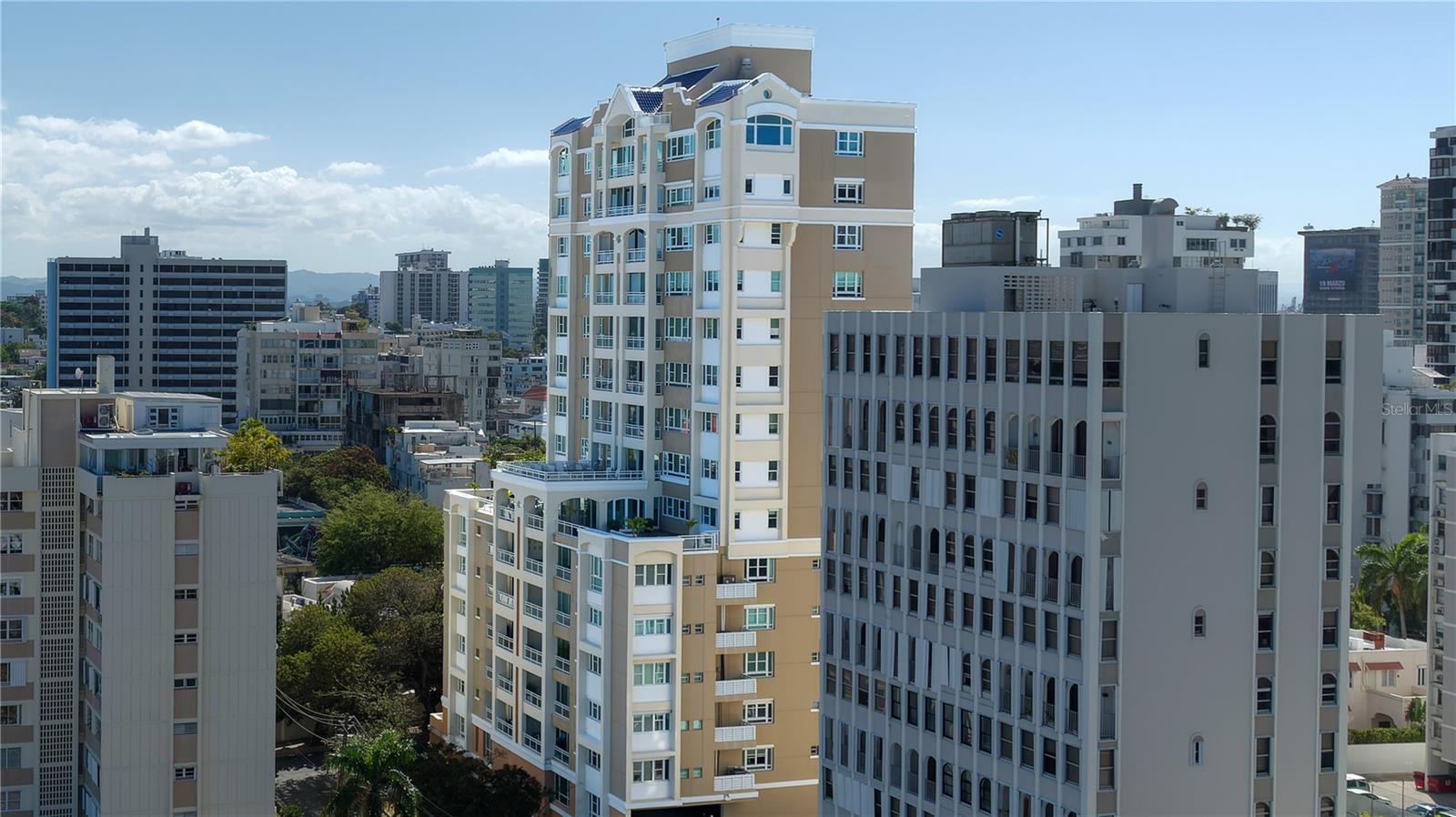 ***SOLD*** Rare to find, completely curated, triple mint residence on Carrion Court Street. This third-floor northeast-facing unit offers 2,611 sq. ft. of living space, inclusive of a full-length covered balcony in the living room, 3 bed, 2.5 bath, and 3 garage parking spaces. A 2023 full rehab has uplifted the meticulous, on-trend city-beach lifestyle of the district, led by renowned interior designer Fernando Rodriguez. Large slab white striated marble floors run throughout the expansive living/dining/entertaining areas, creating a neutral palette for this sophisticated reimagining of the space. Calico floor-to-ceiling murals highlight the entry foyer, featuring lofty 9-foot ceilings and an open layout. The ultra-modern kitchen and cabinetry, striking in both appearance and purpose, are born from the ingenuity of Studio Life Design, and are complete with brushed acrylic black Bosch and Subzero appliances. Inclusive of wine tower, double oven, in-counter electric range, ice maker, and water filtration system. Hidden pocket doors offer entry into the more than ample laundry and mudroom. A primary suite built for ultimate privacy, the subtle undertones of color blend a natural union of both symmetry and style, featuring an ensuite bath with a Euro soak tub, stand-alone shower, and double vanity. The full-space walk-in rounds out this elegant bedroom. The second bedroom offers in-room access to the jack-and-jill bath, shared with the third bedroom uniquely designed as a full Pilates studio. Carrion Court Plaza presents an inviting walkable lifestyle, where coastal living seamlessly intertwines with modern conveniences. Its prime location, just a block away from the beach, is complemented by its proximity to the island's top schools and an assortment of exquisite dining options, creating an irresistible destination for those in search of a dynamic and enriching community experience.
