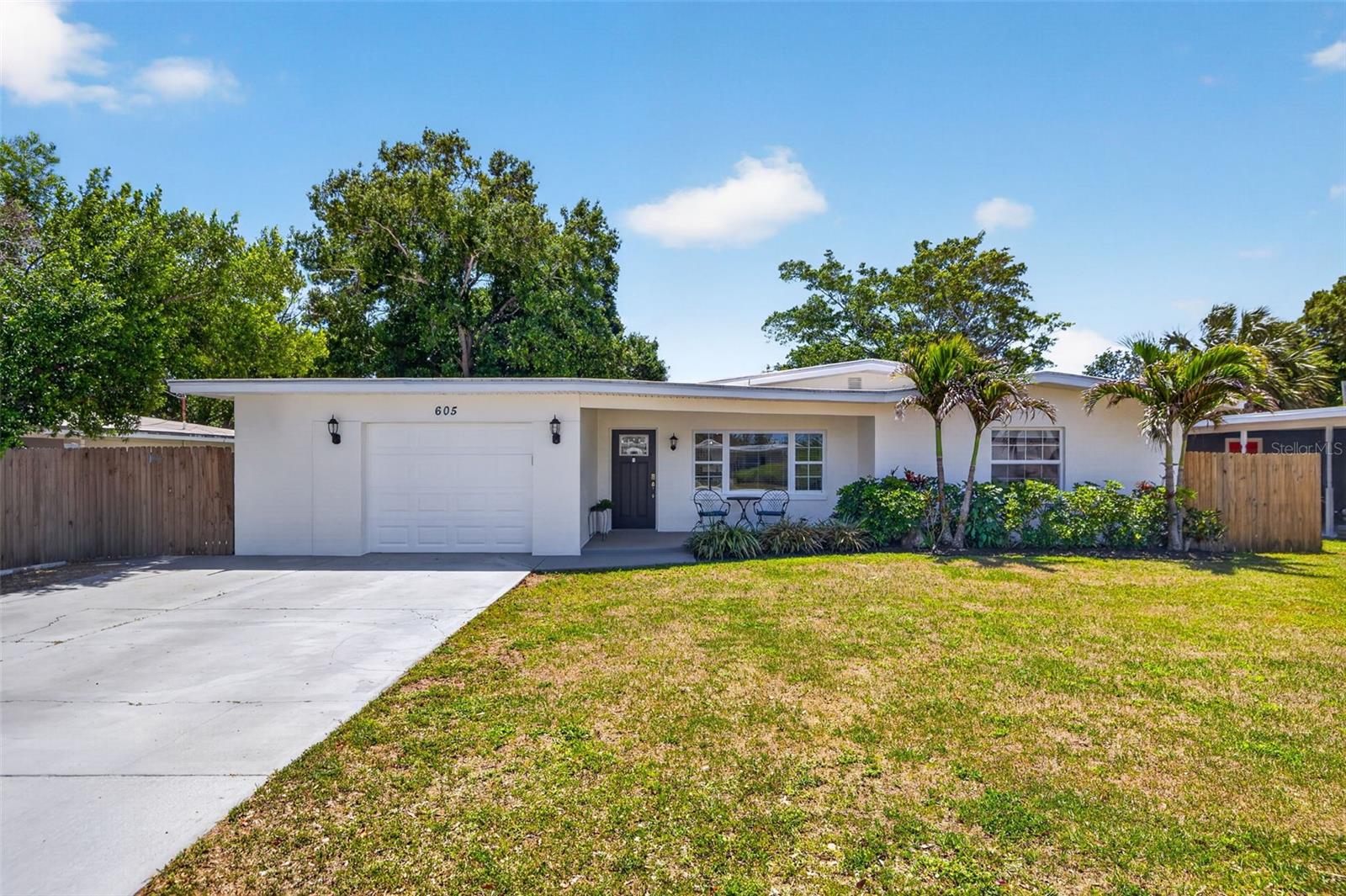 Tucked away in the heart of Belleair Bluffs, this beautifully updated 3-Bedroom, 2-Bath home blends modern upgrades, smart features, and an unbeatable location just minutes from the water.
Inside, you’ll find an open, functional layout with luxury vinyl flooring throughout, updated lighting, hurricane-rated windows and garage door, and a spacious primary suite with a full en-suite bath. 

The kitchen has been fully redesigned with modern cabinetry, granite countertops, stainless steel appliances, and seamless flow into the main living areas, perfect for both everyday living and entertaining. A wine and beverage fridge, along with a Waterdrop reverse osmosis system, adds an extra layer of convenience.

The third bedroom offers flexibility with French doors, its own mini-split system, and a closet, making it ideal as a true bedroom, home office, or private guest space.

Major system upgrades completed in 2018 include new drywall, full electrical rewire with a 150-amp panel, whole-house surge protector, Roof, HVAC, and Water Heater. Fresh exterior paint completed in 2026. Smart home features like a Nest thermostat and Ring doorbell round out the home’s modern appeal. New garage door opener 2026.

Step outside to a fully fenced backyard with multiple access points, including French doors leading directly out, creating an easy indoor-outdoor flow. A separate gated side yard with turf offers the perfect low-maintenance space for pets to play and roam. There’s plenty of space to relax, entertain, or play, along with an 8x12 storage shed. A rare oversized storage room off the garage provides even more room for tools, holiday décor, or hobby space.

Perfectly positioned near restaurants, boutique shopping, medical facilities, golf courses, and world-class Gulf beaches, you’re also just a quick 2-minute drive to the Belleair Causeway for waterfront sunsets, paddleboarding, and boating.