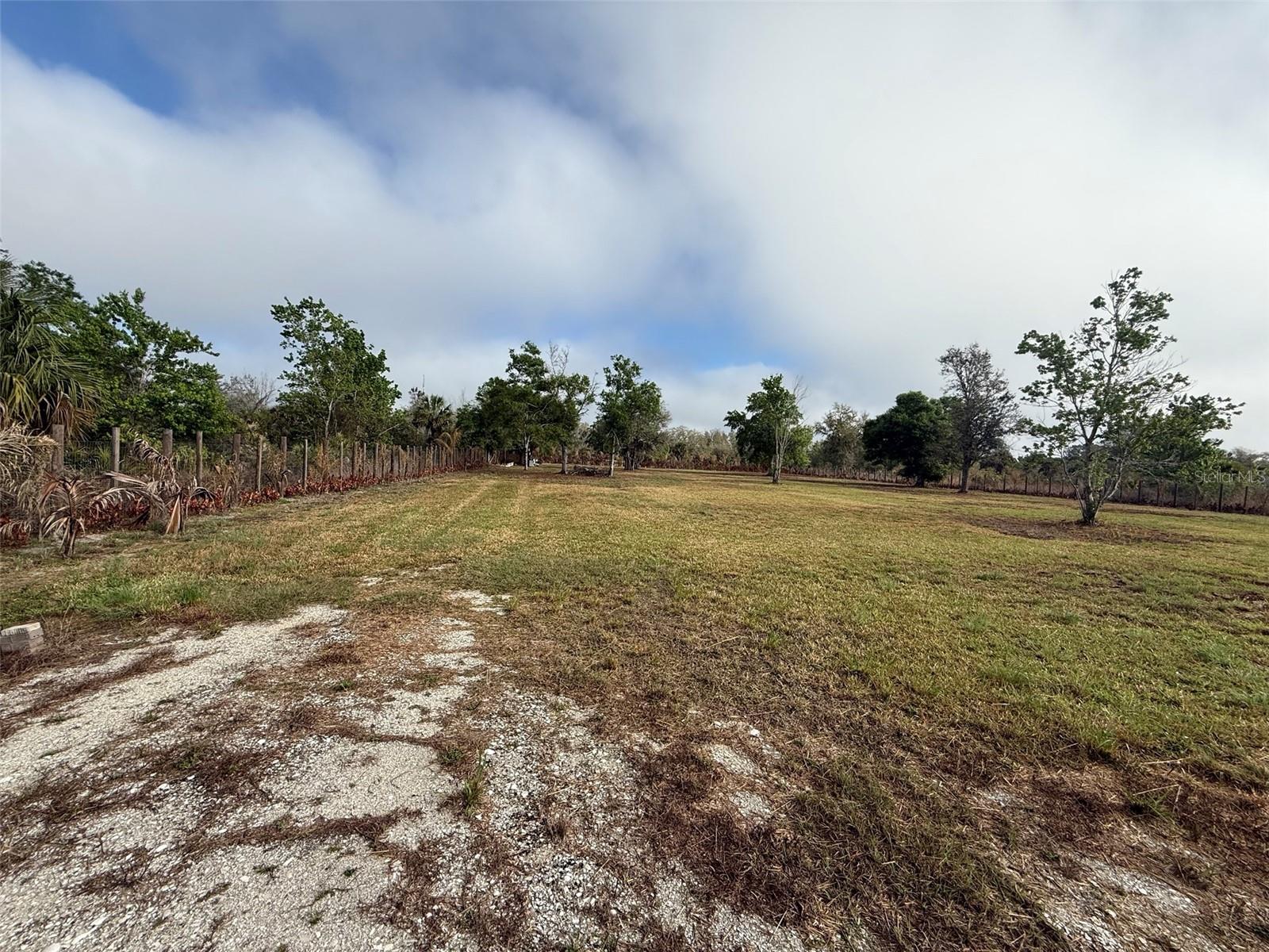 Great opportunity to own your own piece of country living in Okeechobee. This property has already had many improvements completed, including land clearing, fencing with a gated entrance, and a culvert installed for easy access. Per seller there is a well / septic on property (Buyer responsible to verify). The property also includes storage and a shed equipped with a toilet, offering a convenient space for tools, equipment, or temporary use while you continue developing the land. With much of the initial groundwork already done, this property is ideal for a future homesite, agricultural use, recreational getaway, or investment opportunity. Enjoy the peaceful rural setting, wide-open space, and beautiful country surroundings while still being within a reasonable drive to town and local amenities. Bring your vision and take advantage of the endless potential this property has to offer. Pictures provided by the seller. Buyer to verify all property details including zoning, utilities, land use, and building requirements. All information deemed reliable but not guaranteed.