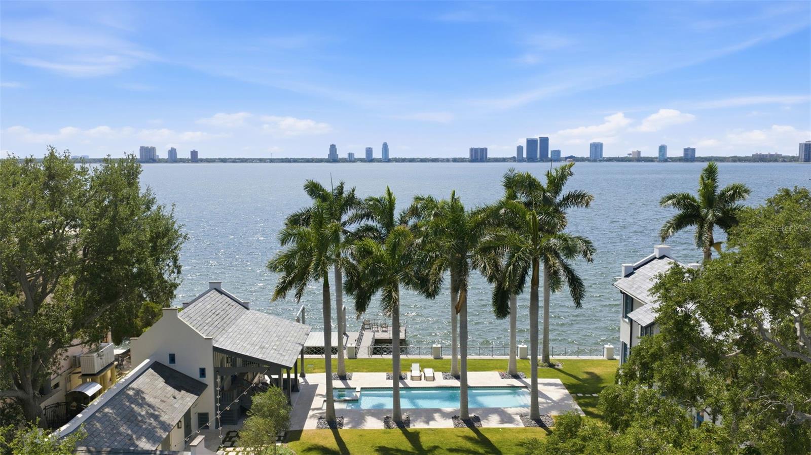 Pre-Construction. To be built. OPEN BAY WATER VIEWS! Introducing a stunning new-construction luxury estate coming soon to the heart of Davis Islands — Tampa’s most sought-after waterfront community. Scheduled for completion in Q4 2026, this architectural masterpiece by Baywalk Homes will deliver an unparalleled blend of modern elegance, elevated craftsmanship, and thoughtful design across 6,737 sq ft of heated living space, featuring 5 bedrooms and 8 bathrooms, sprawled over .31 acres. Every detail of this residence has been carefully crafted to set a new benchmark in Davis Islands living. Enjoy water views from the first living level and above, made possible by the home’s elevated positioning and lower neighboring property. Step inside through a dramatic 26-foot foyer that opens to 14-foot ceilings throughout the main level, creating a grand sense of openness and light. The home also includes a private elevator, office/den, game room, wine room, dual laundry rooms, and a designer kitchen with walk-in pantry and mudroom. The outdoor living experience rivals any resort, featuring a custom pool, spa, and full outdoor kitchen, along with multiple balconies and a sun deck to soak in the views. A 3-car split garage, FEMA Class 4–5 flood-resistant construction, and 80 hours of complimentary interior design service with Baywalk’s in-house designer make this an exceptional opportunity to create your dream home before completion. A true statement of luxury, design, and location — this Davis Islands residence will be one of Tampa’s finest new builds.