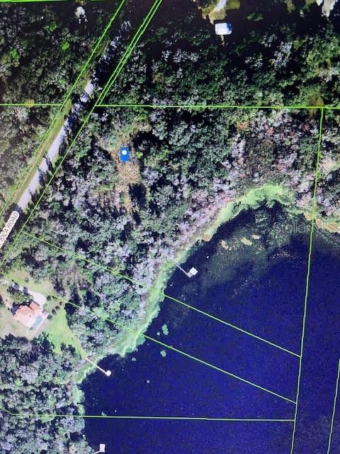 Build and customize your beautiful home in this one of a kind 10.76 acres waterfront lake lot and imagine all of the possibilities this property offers. A rare opportunity to own and enjoy the Florida lifestyle, fishing, kayaking, and canoeing. Create a beautiful garden, grow fruit trees and immerse the privacy and tranquility of this quiet community. 
Come and envision your investment or new home that is a perfect city getaway, conveniently located just 4 minutes to I-75 and 40 minutes to Tampa. This is a must see to invest, build now or build later. 
Aerial photo property lines are an estimate and to be verified by buyer. And buyer to verify acreage, land use, and zoning classification to determine the best and use of land. This is a pristine land that has never been built on and would require buyer to put in well, septic and pay impact fee.