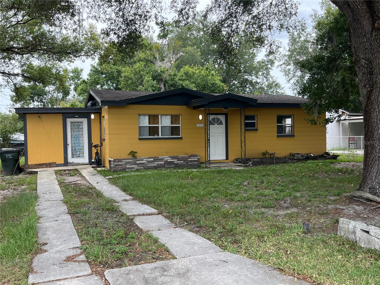 Well-priced home on a large lot – ideal for investors or buyers with vision. This affordable property shows character with its vintage charm, including a pink-tiled bath and solid tile floors throughout, alongside updates like stainless appliances and a mosaic backsplash in the eat-in kitchen. The roomy lot (~0.22 acre) offers a fenced backyard perfect for pets, gardening, or expansion, and a covered side parking area. With no HOA, there’s freedom to renovate or add on. The finished UEP adds extra value and convenience to this solid home.

Located in a family-friendly neighborhood, it’s just a block from North Lakeland Elementary and a short drive to Sleepy Hill Middle. Outdoor enthusiasts will enjoy nearby trails and parks, including Fort Fraser Trail, Circle B Reserve, and Hollis Garden. Commuters benefit from easy access to I-4 and proximity to Lakeland Linder Airport. This home’s solid structure and location make it a great value for savvy buyers. Bring your ideas for cosmetic updates – a little TLC will yield strong equity upside in this convenient North Lakeland location.