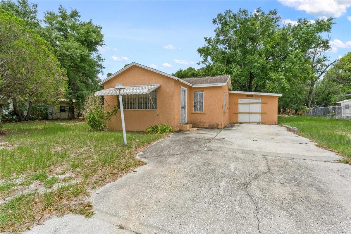 Investor and developer opportunity. Existing home offers potential as a rental property, renovation project, or redevelopment play. We have a scope of work we can share and contractor estimates for under $23,000 to make the property ready to rent.  The house is situated on a 100' x 107' double lot comprised of original platted Lots 5 and 6 and zoned RM-16 Residential Multi-Family. Property may offer the potential for a lot split, new construction, attached residential, or other higher-density residential development opportunities. Buyer to independently verify zoning, lot split, density, and development potential with the City of Tampa. Seller financing available for qualified buyers.