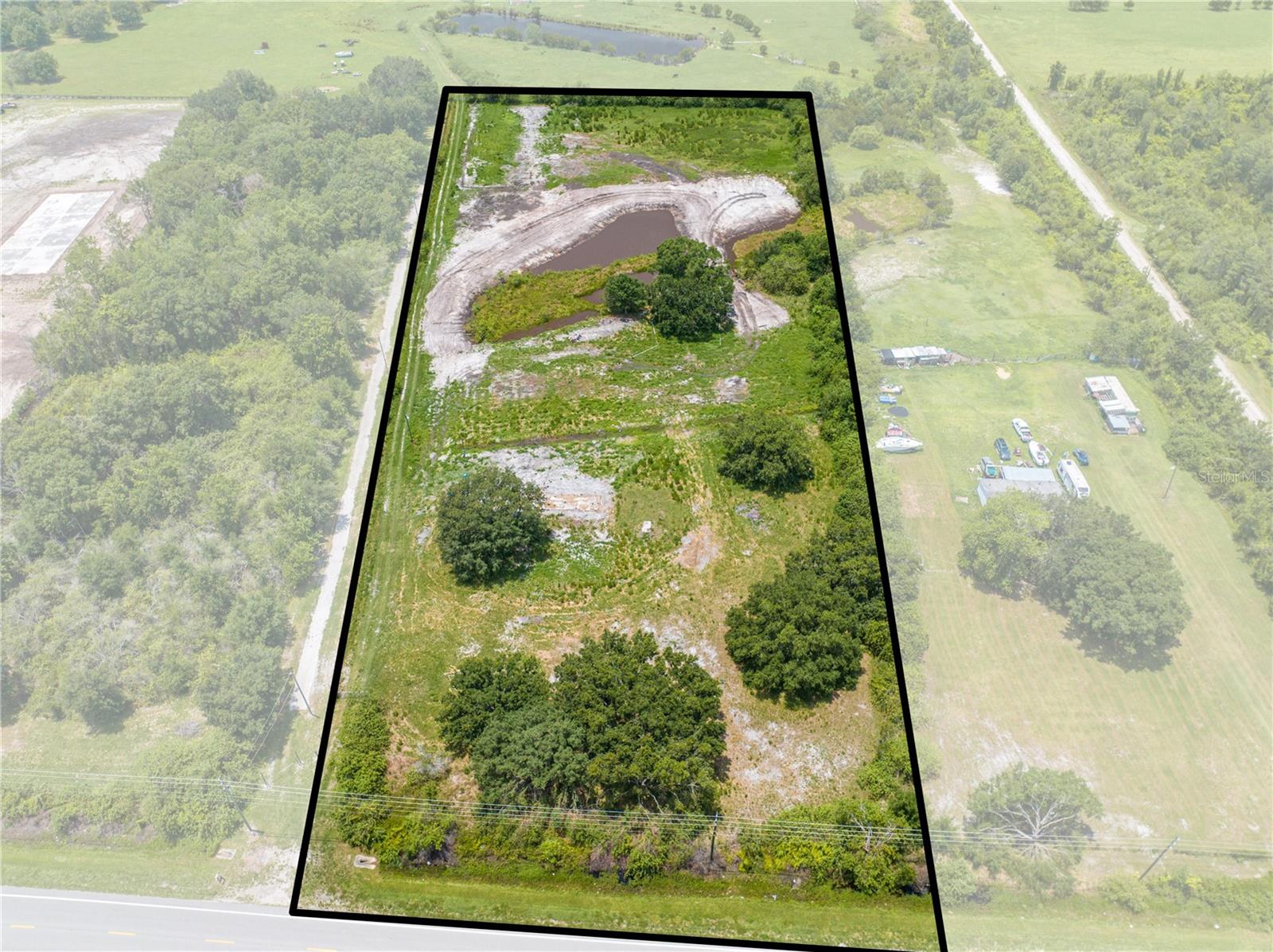 Bring your builder, your boots, and your blueprints — this 6.59-acre gem is the golden ticket to your dream home or next smart investment. With over 265 feet of paved road frontage, access is easy, visibility is prime, and the options? Endless. Tucked in a peaceful yet super-convenient location just minutes to Melbourne and the beaches, you'll enjoy the best of both worlds: wide-open space and coastal convenience. Picture sipping coffee by your own private pond, watching the sunrise, and knowing your nearest neighbor is far enough away to keep the peace. And here's the kicker: this property comes with a FULL IMPACT FEE CREDIT — a $37,000 value already handled. That’s money back in your pocket and one less hurdle on your way to building. No HOA. No timeline to build. Just land that’s flat, beautiful, and ready for action, Its Cleared has a Credit And is calling your name. Let’s meet for you private showing! — this one won’t last