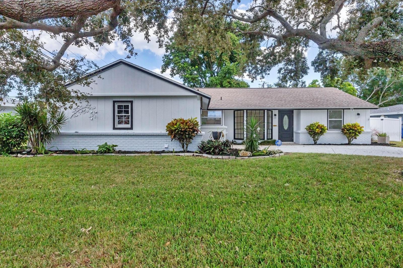 Step inside this beautifully remodeled mid-century modern gem located in the highly sought after Gulf Gate community. This stylish 3-bedroom, 2 bath home also features two versatile bonus rooms, perfect for a home office, fitness room, Florida sitting room, or playroom, offering flexibility to fit your lifestyle. In keeping with its mid-century roots, the original Terrazzo flooring has been fully restored and polished, preserving the home's character while everything else has been reimagined with modern updates. The brand-new kitchen shines with custom cabinetry, granite countertops, stainless appliances, and an eat in kitchenette, creating an inviting space for everyday living and entertaining. Both bathrooms have been completely remodeled with new vanities, showers, fixtures and lighting for a fresh, contemporary look. Major upgrades include a new roof, new AC, and new Hot water heater, updated electric panel to 200 amps with new wiring to all light fixtures, main drain from house to sewer has been flushed, 2 large windows have been replaced with hurricane impact windows, all providing peace of mind for years to come. Enjoy Florida living at its best in the beautiful, fenced backyard, surrounded by mature landscaping and shade trees, ideal for relaxing or hosting gatherings, or a playground for your furry friends. Perfectly situated just a few miles from the world-famous Siesta Key Beach and only six minutes to Crescent Beach, Gulf Gate offers convenient access to schools, shopping, dining, downtown Sarasota, St. Armand's Circle, Lido Beach and Venice Beach, and is an Old Florida quiet neighborhood. This move-in ready home blends classic charm with modern luxury, a rare find in one of Sarasota's most desirable neighborhoods.