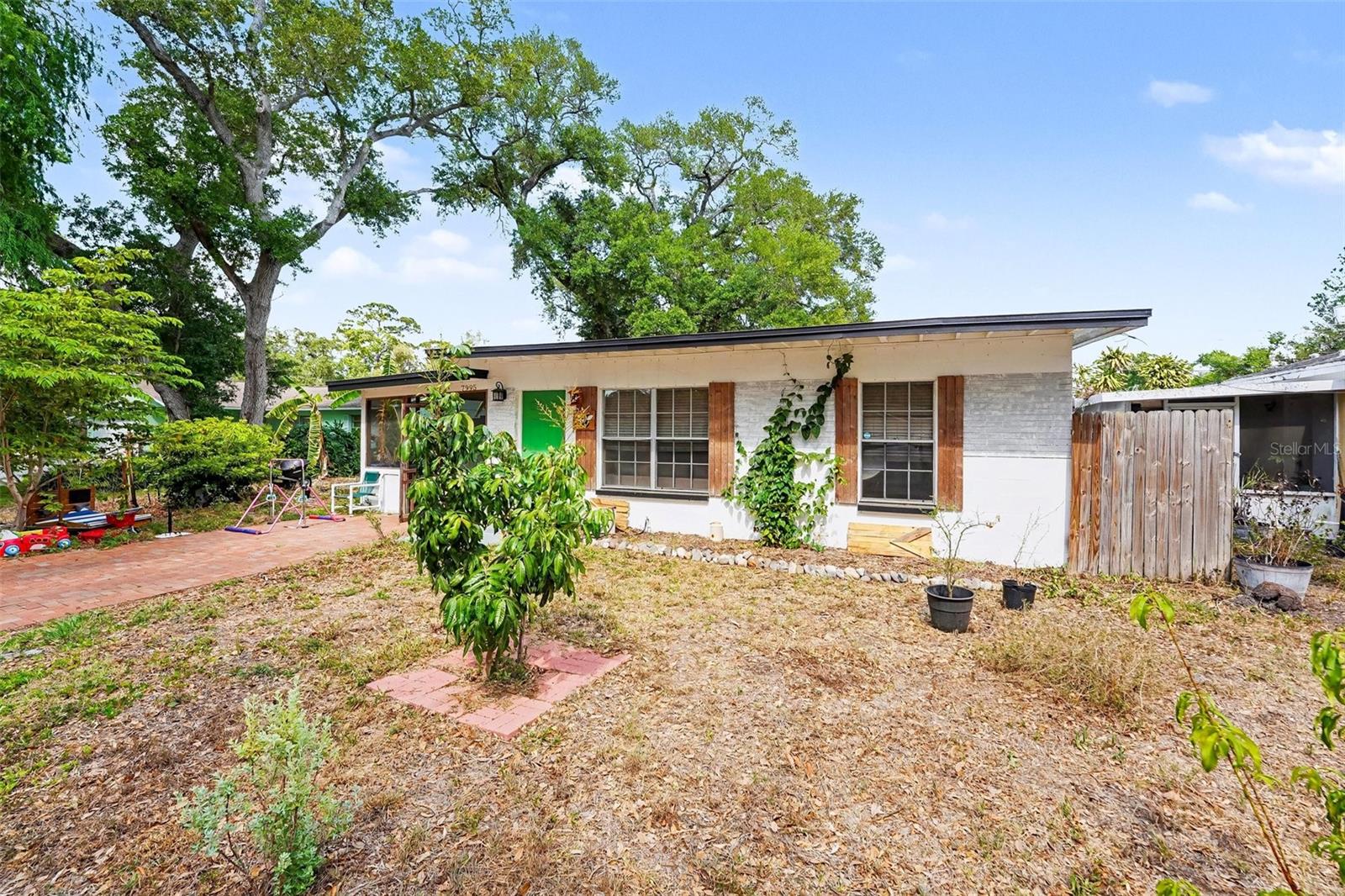 Welcome to your own tropical oasis in the heart of Pinellas Park! This charming concrete block home is more than just a residence; it’s a sustainable lifestyle opportunity. Nestled on an oversized, fully fenced lot, this property is a gardener's dream, boasting a "food forest" of mature fruit trees and lush vegetation that provides both privacy and a fresh harvest right from your backyard.
Step through to the spacious screened-in porch, where you can enjoy the Florida breeze without the bugs—the perfect spot for your morning coffee or hosting weekend BBQs. With an open floor plan, updated stone countertops, and move-in ready appeal, this home perfectly balances cozy living with expansive outdoor space.

Prime Location & Top Attractions
Centrally located with easy access to the best of Tampa Bay:

Freedom Lake Park (5 mins): A local favorite for walking trails, playgrounds, and serene lake views.

The Pinellas Trail (10 mins): Access miles of biking and walking paths connecting you from St. Pete to Tarpon Springs.

World-Famous Beaches (20 mins): Just a short drive to the powdery sands of Madeira Beach and Treasure Island.

Downtown St. Pete (15-20 mins): Home to the Dali Museum, the St. Pete Pier, and a vibrant nightlife and dining scene.

Tampa International Airport (25 mins): Convenient for travelers and commuters alike.

Highly Rated Schools
Located within the Pinellas County School District, known for its excellent specialty and magnet programs:

Pinellas Park Elementary (Nearby local convenience)

Pinellas Park Middle School

Pinellas Park High School (Home to prestigious First Responders & Criminal Justice programs)

Charter/Magnet Options: Easy access to nearby Covenant Academy and Plato Academy.