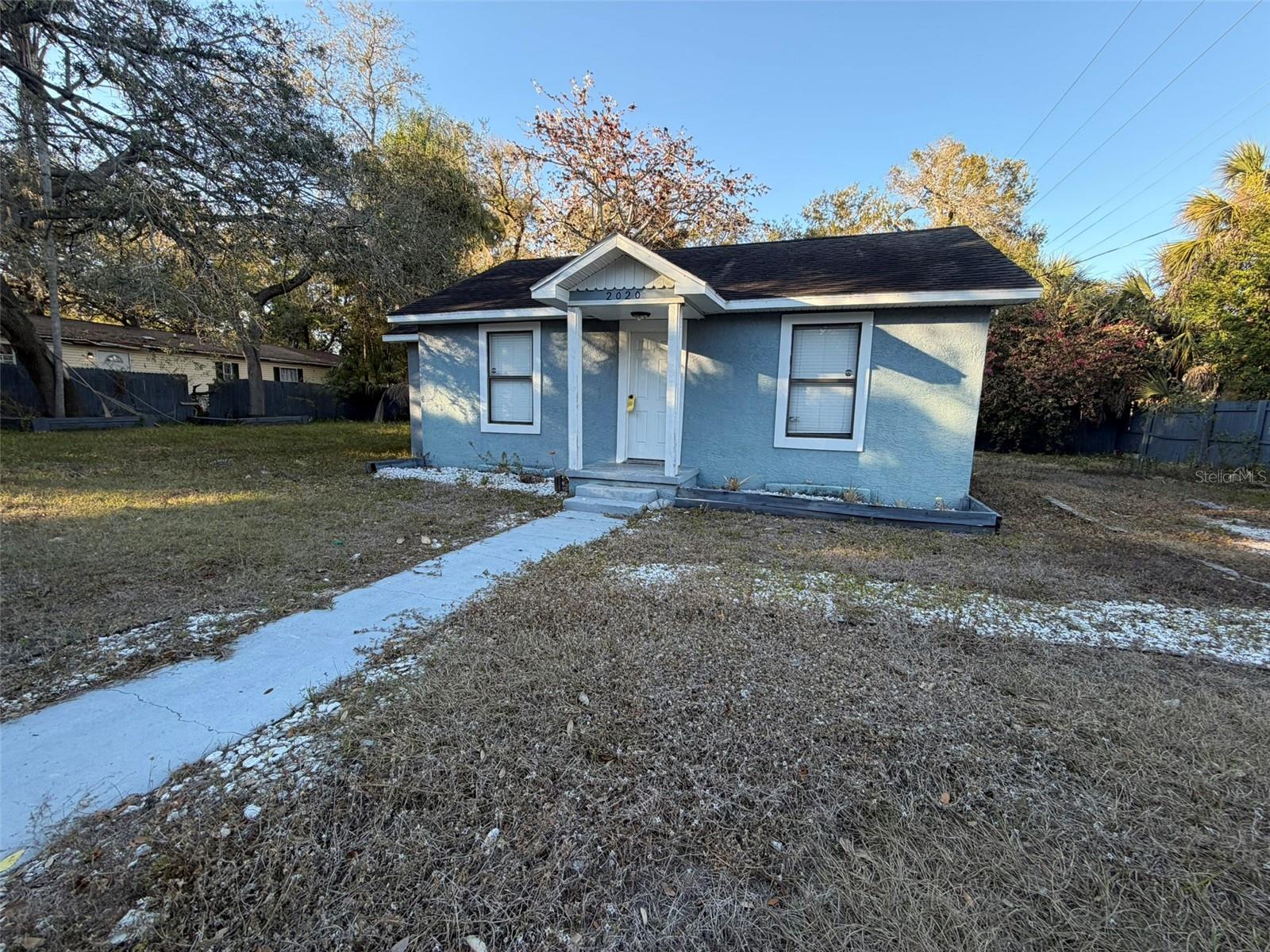Welcome to your charming new home in the heart of Old Seminole Heights! This delightful two-bedroom, one-bath residence is perfectly situated in one of Tampa’s most sought-after neighborhoods—offering the ideal blend of comfort, convenience, and character. Step inside and you'll immediately notice the easy-care tile flooring that flows throughout the home, creating a clean and cohesive feel. The kitchen is beautifully updated with sleek granite countertops, stainless steel appliances, and newer cabinetry—perfect for whipping up your favorite meals. The same granite carries into the tastefully remodeled bathroom, giving the space a modern and polished touch. Thoughtfully updated over the years, this home features newer windows that let in tons of natural light, stylish lighting fixtures, and an indoor laundry/storage room complete with a newer washer and dryer. Major systems have been upgraded for peace of mind, including a new A/C (2020), new water heater (2021), updated plumbing, and a new electrical panel. Step outside to your oversized, fully fenced backyard—an entertainer’s dream! Whether you're hosting weekend barbecues, enjoying a morning coffee on the private covered porch, or letting your pets run free, this outdoor space offers both privacy and endless potential. Location, location, location! You’ll be just minutes away from vibrant downtown Tampa, local restaurants, shopping centers, trendy boutiques, malls, and Tampa International Airport. Everything you need is right at your fingertips.