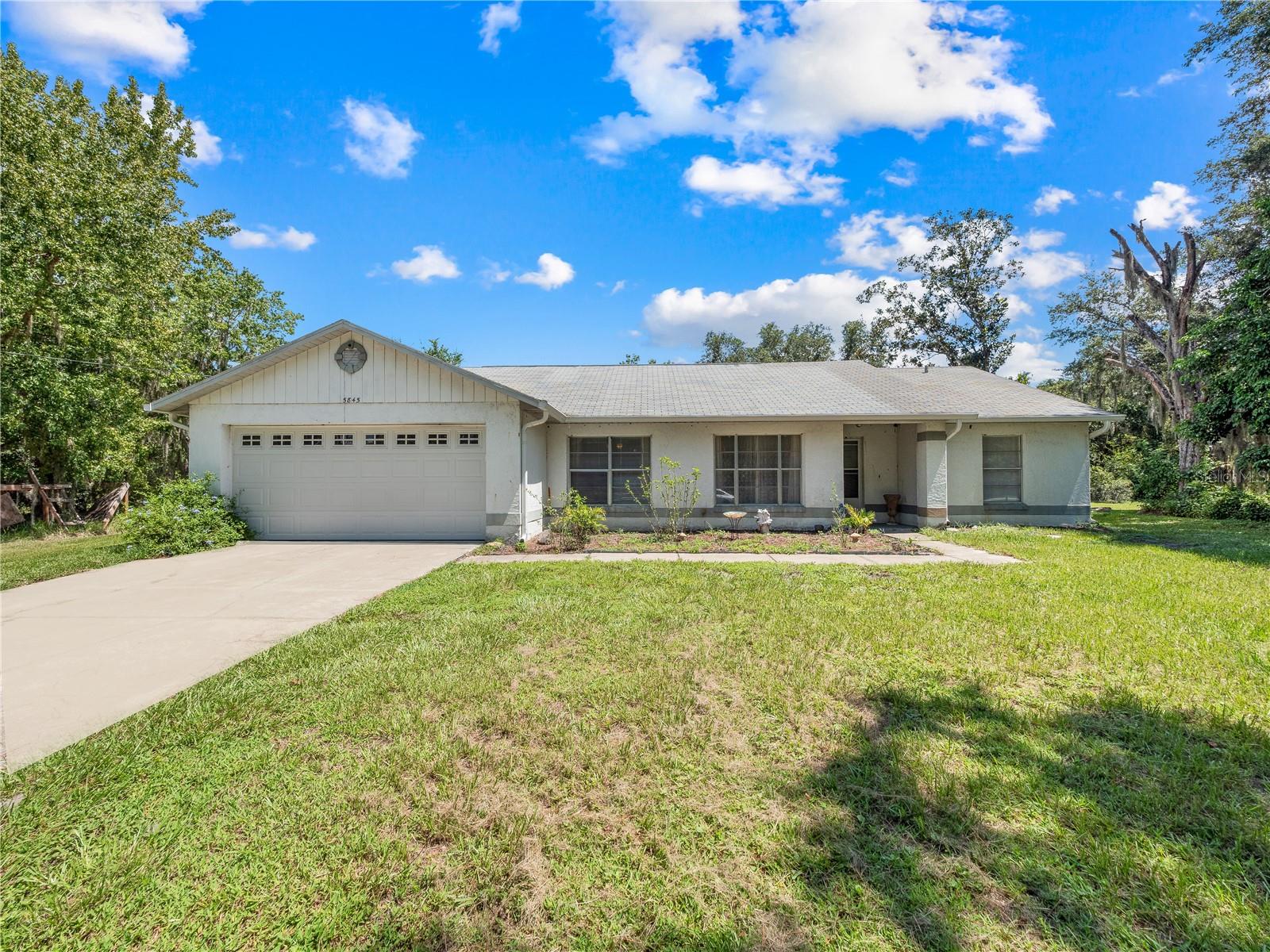 Spacious Living Meets Florida Charm on 3.74 Acres! Discover the perfect blend of privacy, comfort, and convenience in this beautiful 3-bedroom, 2-bathroom home situated on an impressive 3.74-acre lot in the heart of Saint Cloud, Florida. With plenty of room to create your dream outdoor oasis, this property offers endless possibilities for entertaining, gardening, or simply enjoying peaceful country-style living.
Step inside to an inviting open floor plan featuring vaulted ceilings, elegant granite countertops, and easy-to-maintain tile flooring throughout. The spacious kitchen flows seamlessly into the living areas, creating the perfect setting for family gatherings and entertaining guests. Relax year-round on the screened-in porch, where you can enjoy your morning coffee or unwind in the evenings while taking in the serene surroundings—without the bugs. Conveniently located just minutes from shopping, dining, major highways, and Orlando International Airport (MCO), you'll enjoy the tranquility of Saint Cloud while remaining close to all that Central Florida brings.
 Property Highlights: 3 Bedrooms | 2 Bathrooms, 3.74 Acres of Land, Granite Countertop,Vaulted Ceilings, Tile Flooring Throughout, Screened-In Lanai, Plenty of Space for RVs, Boats, or Future Expansion, Prime Saint Cloud Location, Easy Access to Orlando, Theme Parks & MCO Airport. This is more than a home—it's a lifestyle. Don't miss your opportunity to own this incredible piece of Florida paradise! Schedule your private showing today!