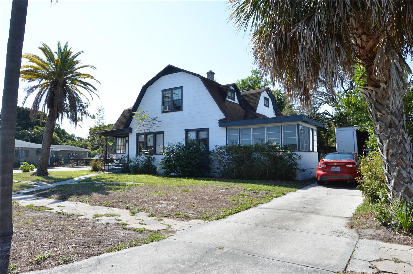 Investor special with exceptional redevelopment potential! Situated on a large 127x97 corner lot in St. Petersburg, this 0820 (Duplex–Triplex–Fourplex) multifamily property currently features three separate living units, offering immediate income and long-term upside. The main residence is a spacious classic Tudor-style home with 3 bedrooms and 2 bathrooms, accompanied by an attached 1-bedroom, 1-bath in-law suite. Toward the rear of the property, a detached 2-bedroom, 1-bath cottage includes a laundry room and a separate 2-car garage, adding even more versatility. Also the lot is zoned NT-4 zoning which menas you can develop 4 units on this parcel. 

Ideal for investors, developers, or buyers looking to restore a unique property, this is a rare opportunity to renovate, redevelop, or build new. With strong potential and multiple options, this property is priced to reflect its condition and opportunity. Don’t misIs your chance to capitalize on this prime corner lot with multifamily zoning!