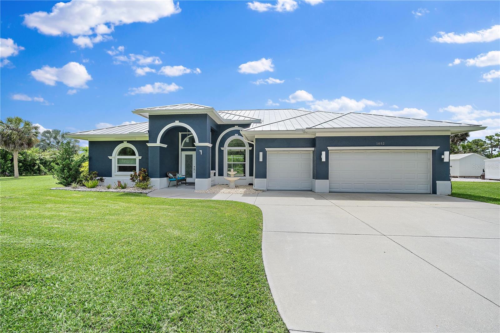 This Gulf Access Pool Home on a Double Lot! This stunning waterfront home sits on a rare double lot with 160 feet of water frontage, offering boat dock, lift, a concrete seawall, and ample space for outdoor enjoyment. Located out of the flood zone, this property boasts a southeast-facing backyard, providing sunlight almost all day long, perfect for relaxing or entertaining. The home features a versatile and flexible floor plan, with a family room, living room, dining room, and a cozy dinette area framed by an aquarium window that brings the beauty of the outdoors inside. The beautiful kitchen featuring quartz countertops, a tiled backsplash, a large island, a breakfast bar, and a pantry, ideal for cooking, entertaining, and creating memories. It seamlessly connects to the living areas, making it the perfect gathering space for family and friends. An indoor laundry room adds convenience and practicality to everyday living. The split floor plan provides privacy and comfort, with the primary bedroom suite located on the left side of the home and the two additional large bedrooms (12x13) on the opposite side. The luxurious primary suite features his-and-her closets, a spa-like bathroom with a large walk-in shower with quartz shower walls, his-and-her vanities, a garden tub, linen closet and a private water closet. Three sets of sliding glass doors lead to the inviting SALT-WATER swimming pool, creating a seamless connection between indoor and outdoor living. The tall ceilings with crown molding, elegant arches, and stately columns add a sense of grandeur, while updates like a new metal roof (2023), an HVAC system (2017), hurricane windows, and accordion shutters on the sliders provide peace of mind. Outdoors, the property is a true gem. It features new pilings and a 40x8 Trex boat dock, concrete seawall, two spacious sheds (24x11 and 12x10), and a large area for RV or boat parking. The beautifully landscaped yard, with low-maintenance rocks surrounding the home. Additional features include city water, irrigation by well, and a three-car garage for all your storage needs. This home combines elegance, functionality, and waterfront living in a way that is truly unmatched. Home has luxurious upgrades, and stunning outdoor spaces with it’s a one-of-a-kind property you won’t want to miss. Schedule your private showing today!