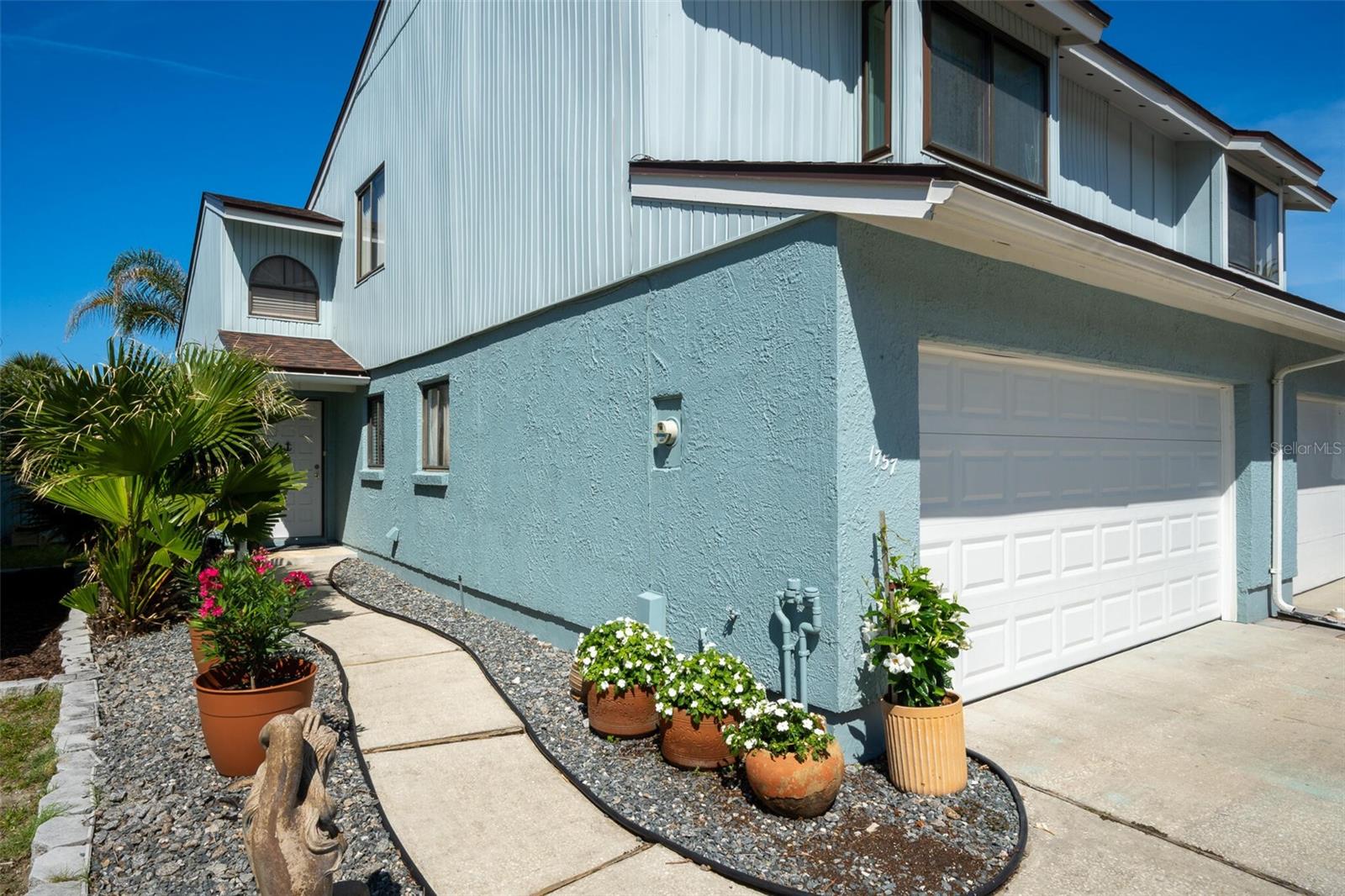 1 1/2 Blocks to the beach. YOU OWN YOUR LOT. INSIDE LAUNDRY ROOM.  Private wooded lot backs to Silver Lake Canal. 2 car garage. 2 Large bedrooms 2 1/2 Baths. LOFT can be 3rd Bedroom, has a closet. 3/4" solid bamboo floors. Inside enclosed porch. 2 new skylights.  COMPLETELY REMODELED 2019: NEW Roof, HVAC,  WaterHeater. Kitchen Cabinets, Maytag Kitchen Appliances. Hurricane Windows East. Live the Laid back Flagler Beach Lifestyle CHOICE HOME WARRANTY Transferable