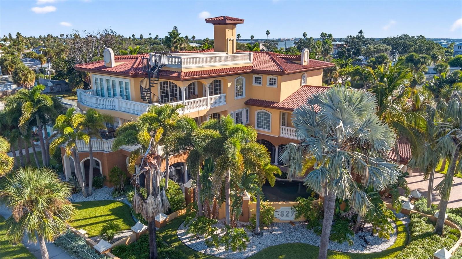 Luxury Clearwater Beach Home for Sale — Double Lot, Pool, and Designer Finishes
Experience true coastal elegance in this magnificent luxury home for sale in Clearwater Beach, Florida. Beautifully constructed with exceptional architectural design and high-end finishes, this custom-built estate sits on a spacious double lot just a short walk to the world-famous sugar-sand beaches of Clearwater Beach. Offering 7,261 sq. ft. of heated living space and 13,633 sq. ft. total, this 5-bedroom, 4 full-bath, and 2 half-bath luxury residence is designed for refined living and grand entertaining. Step inside the impressive foyer with a spiral staircase and private elevator that connects each floor. The gourmet chef’s kitchen features premium Viking appliances, including a refrigerator, freezer, gas range with pot filler, double ovens, and dual dishwashers. A butler’s pantry with a wine refrigerator, walk-in pantry, and additional sink provides seamless hosting options. Enjoy open-concept living with a spacious living room, gas fireplace, and custom built-ins, along with a convenient office and elegant primary suite. The primary retreat includes a private kitchenette, two walk-in closets, and a spa-style bathroom with a soaking tub, walk-in shower, and bidet. Upstairs, a large family room with gas fireplace and multiple balconies offers stunning indoor-outdoor living. All four guest bedrooms and a main laundry room are located on this level. Outdoor living is unmatched, featuring a covered entertainment area, saltwater pool, hot tub, grilling station, and gas fireplace—all in a private, enclosed setting. Additional highlights include a three-car garage, whole-house generator, and luxurious finishes throughout. This Clearwater Beach luxury home perfectly blends elegance, comfort, and functionality—crafted for both everyday living and grand entertaining. Schedule your private tour today and make this dream coastal estate yours!