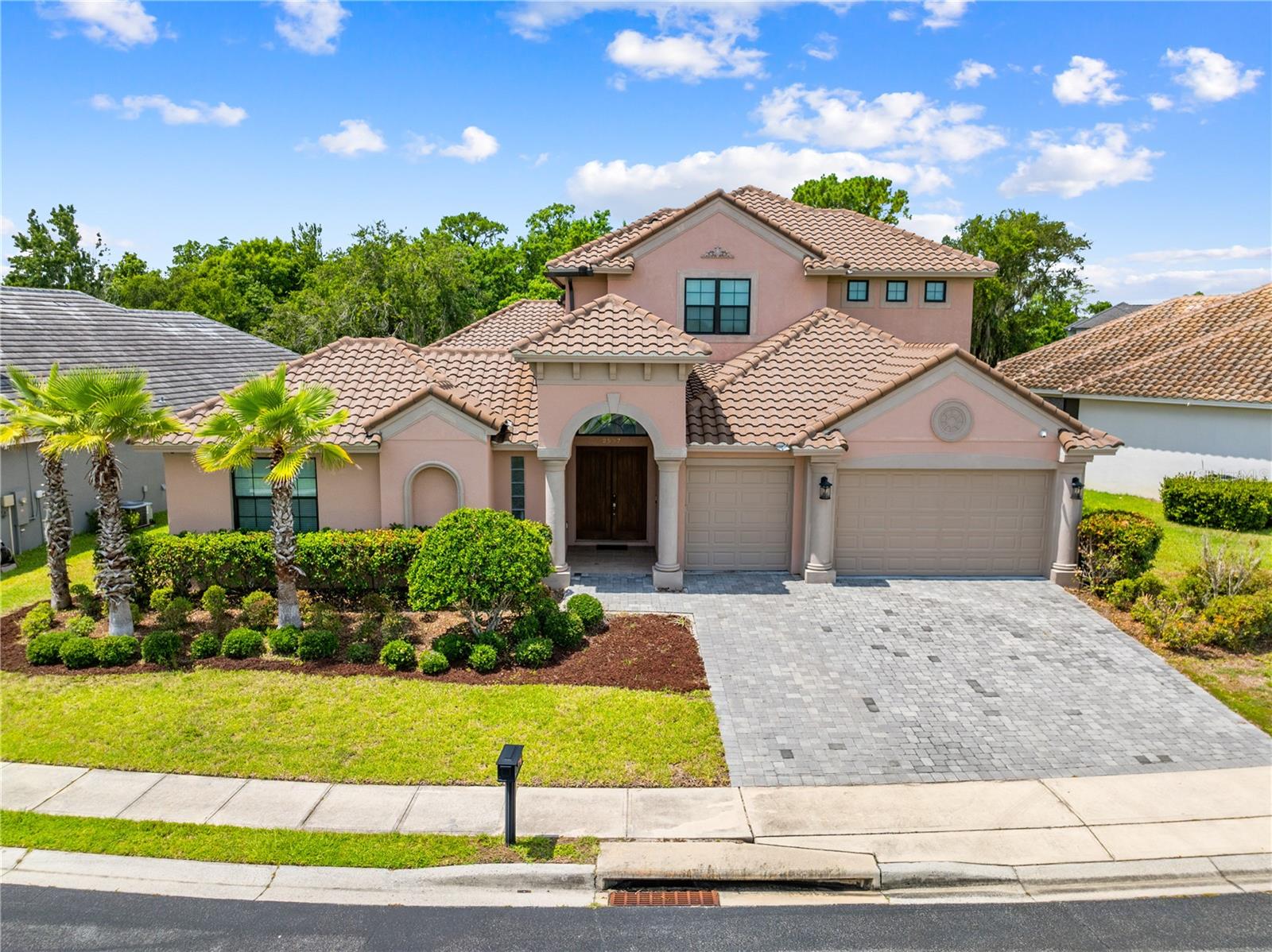 CUSTOM POOL HOME IN GATED COMMUNITY WITH GOLF COURSE.. Prepare to be impressed! Perfectly positioned across from the 6th hole in the prestigious GUARD-GATED COMMUNITY of Providence, this exceptional 4,500 sq. ft. CUSTOM ABD-BUILT home Featuring GUEST HOUSE, RESORT-STYLE COURTYARD POOL, 4 bedrooms, 4 full baths, 1 half bath, a massive BONUS ROOM, LOFT, and 3-CAR GARAGE, this home offers incredible flexibility for today's lifestyle.

The PAVER DRIVEWAY welcomes you to a PRIVATE COURTYARD ENTERANCE centered around a HEATED SALTWATER POOL with paver decking, creating your own personal oasis. The attached guest house features a PRIVATE BEDROOM with sliding glass doors to the pool, a full bath, and endless possibilities as an IN-LAW SUITE, private office, pool house, or guest retreat. Entertain with ease in the covered OUTDOOR KITCHEN complete with a built-in GAS GRILL, and LOUNGING AREA.

Step inside the main home and be captivated by SOARING 21-foot ceilings, abundant natural light, in the elegant LIVING ROOM featuring a cozy GAS FIREPLACE. Throughout the first floor and pool area, you'll enjoy a BUILT-IN SPEAKER SYSTEM with an amplifier located in the family room, making it easy to entertain indoors and out. 

The LUXURIOUS PRIMARY SUITE is privately situated on the first floor and showcases TRAY CEILINGS, a wall of floor-to-ceiling sliding glass doors overlooking the courtyard, an IMPRESSIVE SPA-INSPIRED BATH with dual vanities, SOAKING TUB, walk-in shower, private water closet, and an OVERSIZED WALK-IN CLOSET with 11-foot ceilings.

The heart of the home is the CHEF'S DREAM KITCHEN, beautifully appointed with premium THERMADOR French door refrigerator, gas cooktop, convection steam oven, SUB-ZERO WINE REFRIGERATOR, KitchenAid dishwasher, oversized island with seating, breakfast nook overlooking the pool. Inviting family room with tray ceiling and gas fireplace. Formal dining room, currently used as a playroom, provides direct access to fully fenced backyard—perfect for outdoor enjoyment.

Additional first-floor features include a spacious laundry room complete with washer, dryer, utility sink, and folding station. The home is equipped with THREE A/C units (One for Downstairs, One for Upstairs, and the third for the Pool House).

Upstairs, you'll find a versatile OPEN LOFT with durable rubber flooring, ideal for a home gym, office, or playroom. The second bedroom features a private ensuite bath, while the third bedroom is conveniently located across from a full hall bath. The EXPANSIVE 21' x 37' BONUS ROOM with beautiful wood flooring offers endless possibilities as a game room, media room, home theater, or even a fifth bedroom.

Constructed with concrete block and topped with a durable tile roof, this home combines timeless quality with exceptional design. Security Features include: Security System, Surveillance System with 8 cameras, Timed Exterior Lights, and Two EUFY Door Cameras.

PROVIDENCE RESIDENTS enjoy an unmatched lifestyle with two 24-HOUR MANNED GATES, a CHAMPIONSHIP GOLF COURSE, CLUBHOUSE with PRO SHOP, RESTURANT and LOUNGE, two resort-style SWIMING POOLS, STATE-OF-THE-ART FITNESS CENTER, playground, dog park, scenic walking and biking trails, and beautifully maintained grounds—all just minutes from Central Florida's world-famous attractions, shopping, dining, and major highways.

If you've been searching for luxury, privacy, and resort-style living, you've found it. Schedule your private showing today!