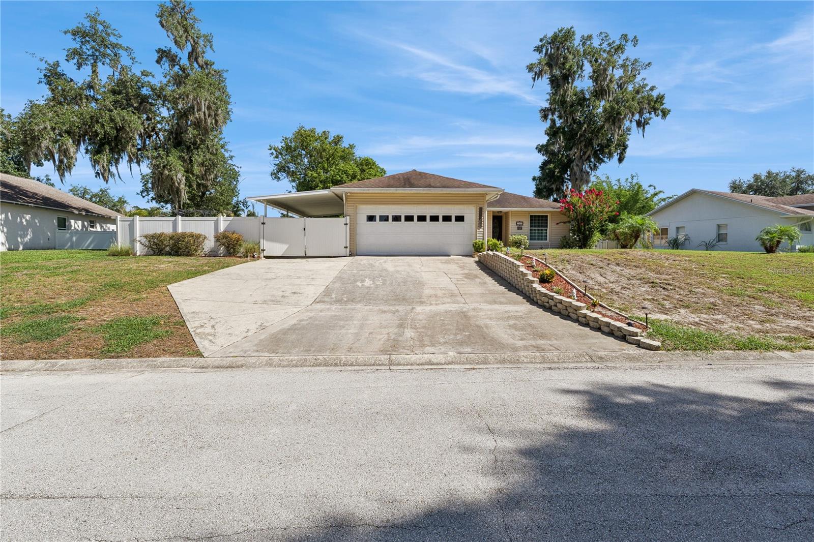 Beautifully Maintained Pool Home in a Prime Lakeland Location!

This move-in-ready 3 bedroom 2 bath with a flexroom/office/ or maybe a nursery home offers exceptional curb appeal, thoughtful updates, and a highly desirable split-bedroom floor plan. Nestled in a convenient Lakeland location with quick access to I-4, shopping, dining, parks, and entertainment, you'll enjoy easy commutes to both Tampa and Orlando while being perfectly situated in the heart of Central Florida.

The oversized driveway provides ample parking and leads to the garage, while additional covered space is ideal for a third vehicle, golf cart, motorcycle, or extra storage.

Mature landscaping and meticulous upkeep create an inviting first impression. Inside, soaring ceilings and an open, spacious layout provide the perfect setting for both everyday living and entertaining.

At the heart of the home, the family room opens to a screened lanai featuring a stunning PebbleTec® saltwater pool, creating a seamless indoor-outdoor living experience that is perfect for relaxing or hosting family and friends.

The split-bedroom design offers privacy and functionality, with two secondary bedrooms and a full bathroom situated in their own wing of the home. The spacious kitchen is designed for both style and convenience, featuring a built-in wine rack, center island with abundant display and prep space, plentiful cabinetry, and a cozy dining area.

Privately located off the main living area, the generous primary suite provides a peaceful retreat. The en-suite bathroom includes a walk-in shower, dual vanities, abundant storage, and plenty of space to start and end your day comfortably.

Additional features and updates include:

AC compressor replaced in 2025
Updated water heater
Cozy wood-burning fireplace
Outdoor television conveys with the sale

From the well-maintained interior to the inviting outdoor living spaces, pride of ownership is evident throughout this exceptional home. Schedule your private showing today and discover everything this beautiful property has to offer!