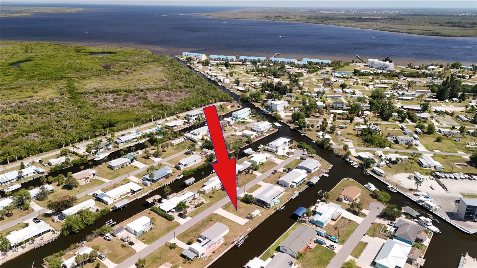 Affordable waterfront opportunity with sailboat access in Port Charlotte / El Jobean. This vacant lot offers approximately 100 feet of waterfront frontage with an existing seawall already in place. Whether you're looking for a place to dock your boat or planning to build a new waterfront home, this property offers direct access to open water and the boating lifestyle Southwest Florida is known for. Conveniently located near shopping, dining, golf, fishing, and Gulf beaches. Buyer should verify all building requirements, utility availability, seawall condition, and water access with the appropriate authorities.