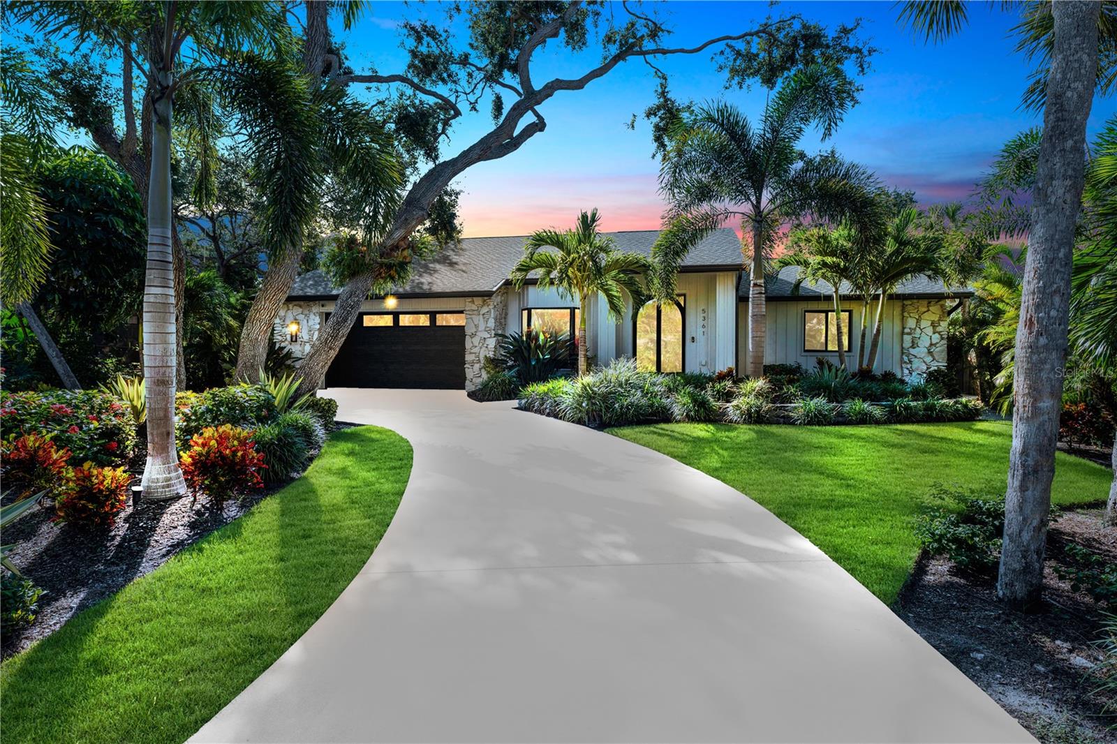 PRICE IMPROVEMENT! Experience tranquility and peace of mind in Siesta Key! Located in the highly sought-after neighborhood of Siesta Cove, this 4-bedroom, 2.5-bath home has been meticulously maintained and generously updated. The current owners completed extensive renovations including a newly remodeled primary bathroom, a custom locally handcrafted iron front door, and stunning iron interior doors with switchable privacy glass in both full baths. 

Peace of mind is paramount here: the home features new hurricane-rated windows, doors, skylights, and garage door. Further structural updates include a new flat roof connecting to the pool cage with new wood framing and super gutters. Additional upgrades include a brand new AC, pool conversion to a heated saltwater system, pre-wiring for security cameras, elegant alabaster chandeliers, a new Café dishwasher, and more. Situated at a high point on Siesta Key, this home experienced no flood water intrusion or damage during the historic 2024 hurricane season. 

The split-bedroom floor plan features pocket sliding doors throughout that practically vanish to create a seamless integration with the sprawling, travertine-floored screened lanai and pool—perfect for entertaining or filling the house with fresh Florida air. Mature tropical landscaping surrounds the home, accentuating the outdoor oasis while providing exceptional privacy. Inside, cathedral ceilings and skylights amplify the spacious, open atmosphere. From the kitchen’s quartz countertops, solid wood cabinetry, gas cooktop, and stainless appliances to the stunning granite-accented gas fireplace, every inch of this home exudes quality craftsmanship and luxury. 

You will love the large laundry room, fully equipped with a sink and cabinetry matching the kitchen's high standards and aesthetic. The fourth bedroom is a private retreat located above the spacious, high-ceiling two-car garage; fully permitted by the current owners, it features its own mini-split system for comfort. Additional conveniences include a whole-home water softener, reverse osmosis kitchen filter, irrigation system, and outdoor shower. With glowing landscape lighting and the colorful Florida sky, this home is absolutely stunning at twilight. The icing on the cake is the location—just one mile from pristine beaches! Make an appointment today to experience the perfect balance of form and function in this incredible Siesta Key home.