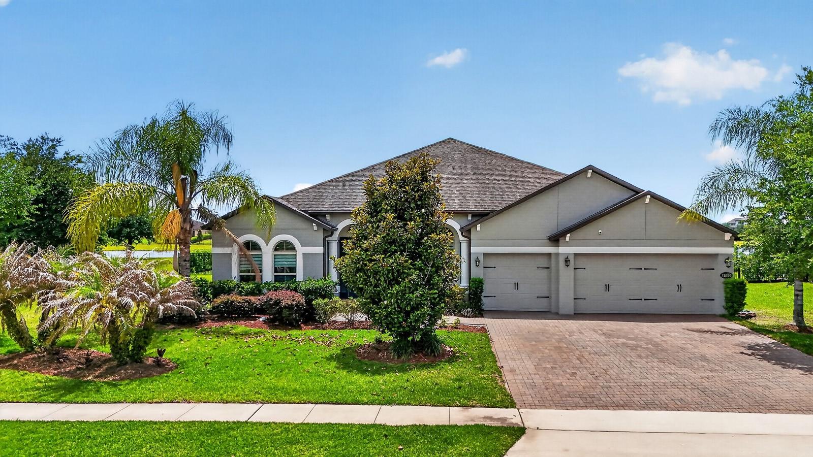 Discover refined Florida living at 17614 Sailfin Dr, Orlando, FL 32820. This elegant 4-bedroom, 3.5-bath pool home offers a thoughtful blend of comfort, style, energy efficiency, and indoor-outdoor living. A grand 8-foot entry door with double sidelights welcomes you into an open-concept design with soaring 11’4” ceilings, abundant natural light, upgraded 8-foot interior doors, and designer finishes throughout.

The spacious family room connects beautifully to the chef-inspired kitchen, complete with 42-inch cabinetry, an impressive 11-foot island, granite countertops, stainless steel GE appliances, and ample storage. Ceramic tile flooring flows throughout the entire home, offering a clean, elegant look with low-maintenance convenience.

Designed for entertaining and relaxation, the home features 10-foot sliding glass doors that lead to a covered lanai, screened-in pool, and serene pond views. The owner’s suite provides generous space for oversized furnishings and a private sitting area, complemented by dual walk-in closets and a spa-style bath with a freestanding soaking tub, oversized separate vanities with granite countertops, and a semi-frameless glass shower.

Energy Star 3.1 certification, Core Fill insulation, R-38 ceiling insulation, radiant roof barrier technology, and Low-E double-pane windows contribute to a home designed for comfort and efficiency. With its pool, covered outdoor living area, pond views, upgraded finishes, and functional layout, this home delivers an exceptional Florida lifestyle.