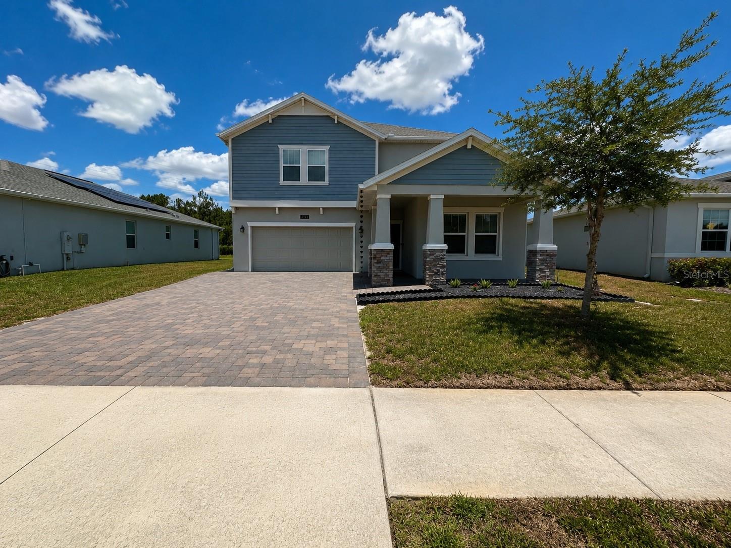 Welcome to 2721 Camden Lane, a spacious and beautifully maintained 5-bedroom, 3-bath home located in the desirable gated golf community of Providence in Davenport. Built in 2022, this two-story residence offers over 3,300 heated square feet, a 3-car garage, and a functional open floor plan designed for comfortable everyday living and entertaining.

The main living area features high ceilings, ceramic tile flooring, abundant natural light, and an open-concept layout connecting the family room, dining area, and kitchen. The kitchen offers modern cabinetry, stainless steel appliances, a large island with seating, pantry space, and excellent flow into the main gathering areas. A downstairs bedroom and full bath provide flexibility for guests, multi-generational living, or a private home office.

Upstairs, the home continues with a spacious loft/game room, generous secondary bedrooms, and a large primary suite with a walk-in closet and an oversized bathroom featuring dual vanities, a soaking tub, and separate shower. The laundry room is conveniently located upstairs near the bedrooms.

Enjoy Florida outdoor living from the covered rear patio and extended paved area overlooking a conservation-style backdrop, offering added privacy and peaceful views. The home sits on a cul-de-sac lot near the golf course and includes solar, public utilities, inside laundry, washer and dryer, and a 3-car attached garage.

Providence offers resort-style amenities including a 24-hour guarded gate, clubhouse, community pool, fitness center, dog park, playground, tennis courts, sidewalks, restaurant, golf cart-friendly streets, and access to the golf community lifestyle. Conveniently located near major roadways, shopping, dining, theme parks, and Central Florida attractions, this home offers the space, location, and community amenities buyers are looking for.