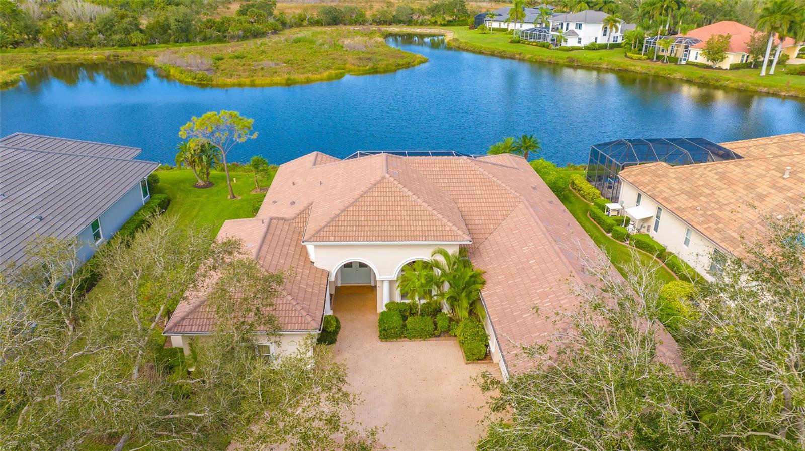 Located on one of the best lots in Silver Oak with expansive water views backed by private preserve (no houses in the back)* This executive home built by Bamboo Luxury Home Bui8lders features a brand new $85,900 roof for lower insurance costs* Unique great room floor plan with 14 ft. ceilings* 3 generous bedrooms plus large office/library* 3.5 baths* Kitchen with new granite counters & new wall oven* Plantation shutters* Recently re-finished & remodeled pool & outdoor kitchen* "Picture Frame Screening" has been installed for unobstructed views of the lake & preserve* Neutral tile throughout living areas with easy care vinyl floors in bedrooms* Master bath has new cabinets & granite counters* Whole house generator* Crown moldings & tray ceilings in master bedroom & great room* New hot water heater* Great room with built in entertainment center & decorative fireplace* 3 car split courtyard garage*  Master bedroom has 2 walk-in  closets* Silver Oak is located on Palmer Ranch close to shopping, Legacy Trail & minutes to world famous Siesta Key Beach* All homes in Silver Oak were built by Sarasota's highest rated custom home builders*