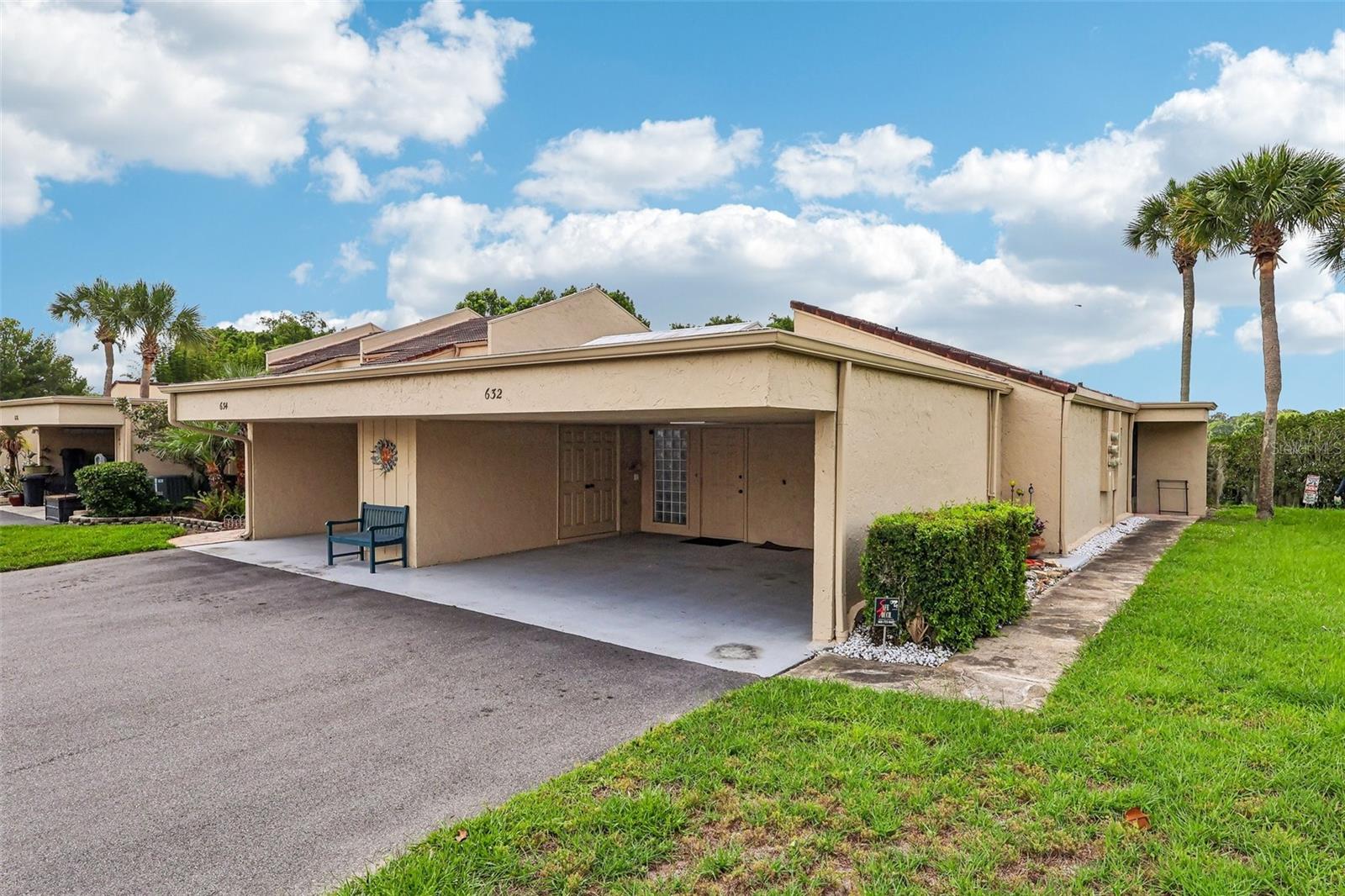 Perfectly positioned along the shores of Lake Howell, this BEAUTIFULLY UPDATED 2-bedroom, 2-bath condominium offers a rare opportunity to enjoy WATERFRONT LIVING, stylish upgrades, and the convenience of an ATTACHED 2-CAR COVERED CARPORT with storage, a feature seldom found in condominium living. Step inside and immediately appreciate the home's elegant updates, including CALIFORNIA BAMBOO FLOORING throughout, crown molding, recessed lighting, UPDATED WINDOWS AND DOORS, a central vacuum system, and AC replaced in 2019. The result is a BRIGHT, POLISHED INTERIOR that feels both welcoming and refined.The BEAUTIFULLY UPDATED Kitchen is designed for both everyday living and entertaining, featuring GRANITE COUNTERTOPS, stainless steel appliances, abundant cabinetry, a breakfast bar, a NEW BACKSPLASH, and a NEW REFRIGERATOR. A cozy breakfast nook provides the perfect spot for morning coffee, while the CONVENIENT PASS-THROUGH WINDOW creates a seamless connection to the Living Room. The Dining area enjoys peaceful backyard and LAKE VIEWS and features sliding glass doors that invite NATURAL LIGHT inside while enhancing the home's indoor-outdoor feel. One of the home's most unique features is the spectacular BONUS ROOM/CONSERVATORY, a light-filled retreat complete with a SPA AND TANKLESS WATER HEATER (2021). With its soaring cathedral ceiling and DRAMATIC ANGLED WINDOWS OVERHEAD, this versatile space feels like a private sunroom where you can relax and unwind at the end of the day. The Primary Suite provides a TRANQUIL ESCAPE, featuring sliding doors leading directly to the conservatory, dual closets, and an EN SUITE BATH with dual sinks and a step-in shower. A second spacious bedroom is conveniently located near the ADDITIONAL FULL BATH, making the layout ideal for guests, family, or a home office. Residents of Sausalito enjoy an IMPRESSIVE selection of amenities, including a sparkling community pool, clubhouse, tennis courts, park, playground, and beautifully maintained grounds, while the HOA also covers exterior maintenance and cable service. Even better, residents have ACCESS TO LAKE HOWELL, and the HOA allows boats, making it easy to enjoy fishing, boating, kayaking, and waterfront recreation. CONVENIENTLY LOCATED in Casselberry, the community is close to shopping, dining, and entertainment, as well as NEARBY DESTINATIONS such as Secret Lake Park, Red Bug Lake Park, and the boutiques and restaurants of Winter Park. Commuters will appreciate EASY ACCESS to major roadways, while outdoor enthusiasts will love the abundance of parks, trails, and lakes throughout the area. With its LAKEFRONT SETTING, extensive updates, rare 2-car covered carport, and stunning CONSERVATORY-STYLE BONUS ROOM, this exceptional Sausalito condo offers a unique opportunity to enjoy CAREFREE WATERFRONT LIVING in one of Casselberry's most desirable communities. Make this home yours before it's gone!