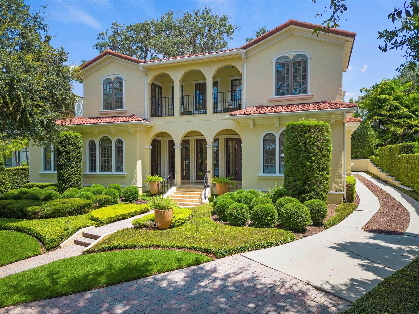 Gorgeous lakefront home on a quiet Winter Park brick road. Enjoy breathtaking views and sunsets from this elevated spacious property, situated on .71 acres. The home takes advantage of abundant sunlight throughout. The living room features a lovely custom stone fireplace and beautiful built-ins. The kitchen is open, light and bright, and located off the formal dining room. Double French doors lead you to a fabulous and stunning Shangri La backyard with pool, patio, outdoor fireplace and mature landscaping. Downstairs primary suite, double vanities, bidet, tub and shower off pool area. Two closets, beautiful view of Lake Sue. Two full baths plus powder room and laundry room downstairs. There is a flex space off the kitchen that can be used for breakfast nook, office or play area. Two-car garage rear entry. An additional three bedrooms, two full baths and balcony upstairs. Paver circle driveway. Lake Sue is a private ski lake conventionally located between Park Avenue, and AdventHealth and Orlando campuses. Top Winter Park schools. Aurora Award Winning Design by Slocum Platts. Enjoy a glass of wine or a cup of coffee on your private dock. Very peaceful, one owner home. Call for your private showing.