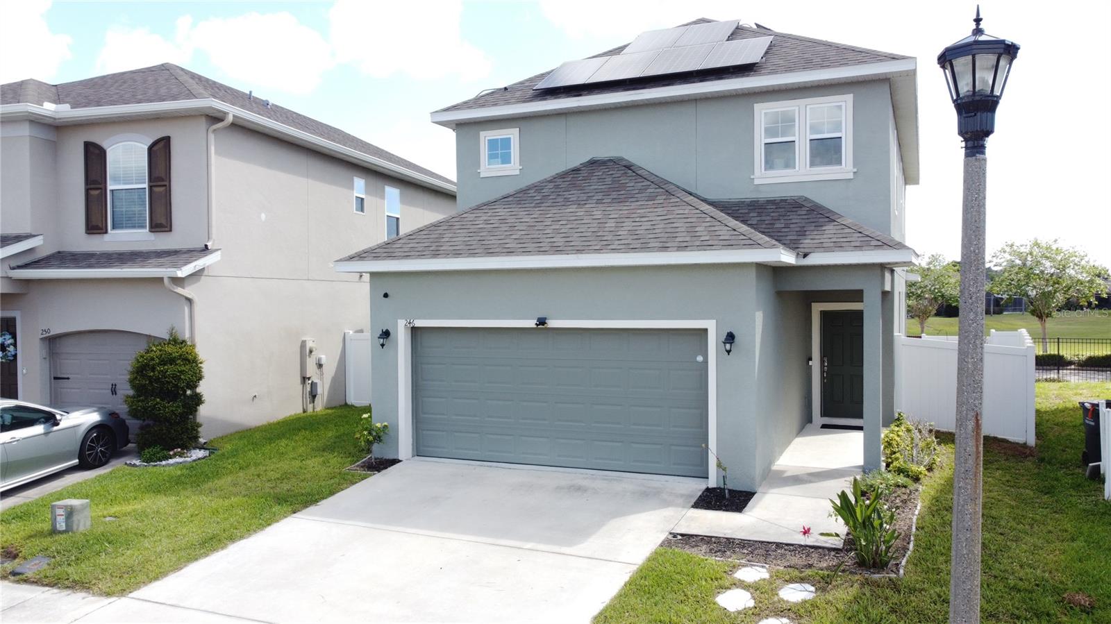 Beautiful 3-bedroom, 2.5-bath single-family home located in a secure gated community just minutes from ChampionsGate, Walt Disney World, shopping, dining, entertainment, medical facilities, I-4, and US 27. This well-presented two-story home offers an open-concept floor plan with the living, dining, and kitchen areas flowing together for easy everyday living and entertaining. The kitchen features granite countertops, included appliances, and ample cabinet space. Upstairs, the spacious primary suite includes a private ensuite bath and generous closet space, while the secondary bedrooms share a well-appointed full bathroom. A standout feature of this home is the fully paid off solar panels, offering added value to the buyer and the opportunity to help reduce monthly electricity costs without taking on a separate solar payment. The outdoor patio and large lanai provide a comfortable space to relax, dine, or entertain. Internet and cable TV are included in the HOA, adding further convenience. The community is zoned for short-term rental, giving this property excellent added flexibility for use as a primary residence, vacation home, or investment property. With easy access to I-4 and US 27, proximity to Disney, shopping and dining nearby at Posner Park, and the nearest beach just over an hour away, this is a perfect place to enjoy Central Florida living this summer. Schedule your private showing today.