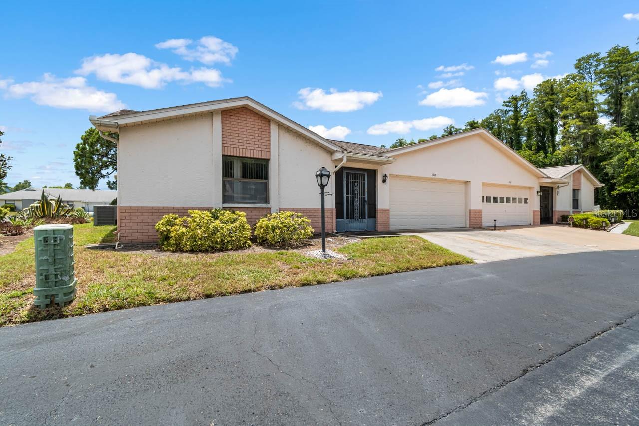 Investor's Special: This 2-bed, 2-bath home in the highly desirable 55+ community of Sun City Center has incredible potential! A little elbow grease and TLC would really make this house a remarkable home. Featuring an ATTACHED GARAGE with space for a car and a golf cart, driveway, guest parking, a COVERED/SCREENED FRONT PORCH, NO CARPET throughout, and an enclosed FLORIDA ROOM! This OPEN CONCEPT floorplan greets you with a spacious living area and one of the three sets of sliders into the Florida Room. The kitchen includes a breakfast/bistro space and all STAINLESS STEEL appliances! The primary bedroom features a WALK-IN CLOSET and EN-SUITE BATHROOM with a single-sink extended vanity and shower stall. The secondary bedroom is positioned near the Laundry Closet and second full bathroom, complete with a single-sink vanity and tub/shower combination. Enjoy all the amenities and activities Sun City Center provides in this great location. Schedule your showing today!
