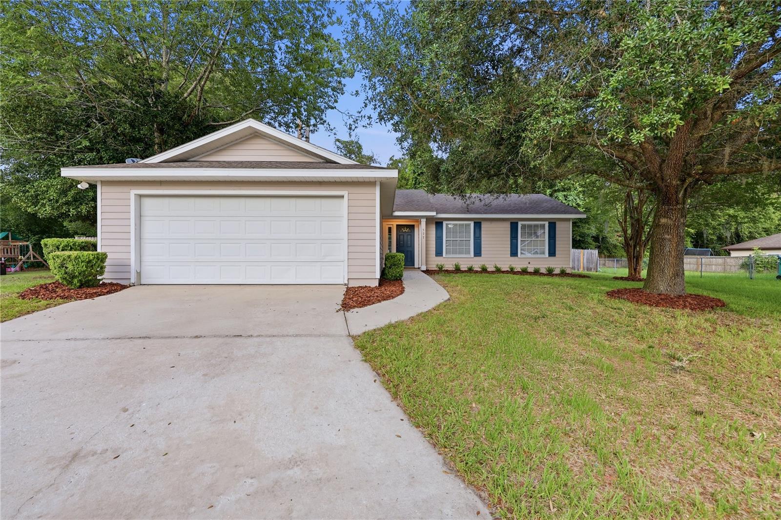 Virtually Staged. Welcome to Bartley Lane, where comfort, convenience, and flexibility come together in the heart of Newberry. Built in 2007, this beautifully maintained 3-bedroom, 2-bath home offers inviting curb appeal, a functional layout, timeless finishes, no HOA, and the added peace of mind of a brand-new roof to be installed prior to closing. Step inside to discover an expansive open concept floor plan with soaring ceilings and luxury faux wood flooring that create a bright, spacious atmosphere throughout the main living areas. The seamless flow between the living, dining, and kitchen spaces makes entertaining a breeze while providing the flexibility today's buyers are looking for. Out back, enjoy an oversized backyard that serves as your own private retreat with endless possibilities for outdoor gatherings, gardening, play, pets, or simply relaxing under the Florida sky. With no HOA, you’ll have no monthly association dues and fewer restrictions, giving you more freedom to use and enjoy the property. Ideally situated in the growing community of Newberry, you'll enjoy access to highly rated schools while being just 10 minutes from Gainesville's shopping, dining, healthcare, and entertainment. Whether you're a first-time buyer, downsizing, or looking for your next chapter, this home offers the perfect combination of location, space, value, and peace of mind. Don't miss your opportunity to make Bartley Lane your next address and experience the best of North Central Florida living.