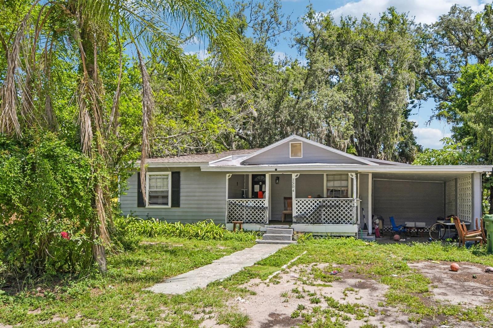 This renovated, move-in-ready property in Tampa, Florida, sits on a lovely shaded lot and offers incredible versatility for both owner-occupants and savvy investors. The main house features central A/C and is intelligently divided into two distinct rental spaces: Unit A, a spacious 3-bedroom, 1-bathroom layout, and Unit B, a private 1-bedroom, 1-bathroom unit with its own separate entrance. Adding even more value to the property is a detached guest house, Unit C, which serves as a cozy studio apartment complete with a kitchenette and full bathroom. Perfect for multi-generational living or maximizing rental income, this unique multi-unit setup provides endless flexibility, with a complete rental history available upon request.