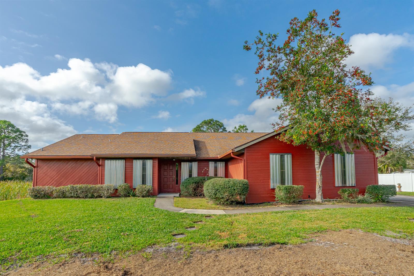 CUSTOM BUILT ONE OWNER 4-BEDROOM HOME SET BACK ON 1 ACRE WITH AMPLE ROOM FOR THE FAMILY AND ENTERTAINING. THE PROPERTY IS ZONED A-3 TRANSITIONAL AGRICULTURE WITH ALMOST 2,500 SQ. FT. OF LIVING SPACE AND OVER 3,600 TOTAL SQ. FT. CERAMIC TILE AND CARPET, SPLIT BEDROOM PLAN WITH LARGE 18X16 MASTER SUITE AND 3 ADDITIONAL BEDROOMS. LARGE KITCHEN OVERLOOKING FAMILY ROOM GREAT FOR FAMILY GATHERINGS. LARGE ATTACHED 2 CAR GARAGE. ENCLOSED BACK PORCH OVERLOOKS POND NEXT TO THE HOUSE AND NATURAL AREA TO THE REAR. HOME COMES WITH HURRICANE SHUTTERS. BRAND NEW ROOF. PROPERTY IS CLOSE TO INTRACOASTAL WATERWAY AND PARKS WITH BOAT LAUNCHES. HAS PLENTY OF PROPERTY FOR YOUR TOYS AND RECREATIONAL VEHICLES OR JUST GREEN SPACE BETWEEN YOU AND YOUR NEIGHBORS. THIS QUIET COMMUNITY IS UNIQUE WITH 1-ACRE SITE-BUILT HOMES ON PAVED QUIET ROAD WITH A SINGLE ACCESS FOR NEIGHBORHOOD RESIDENTS. PROPERTY HAS ITS OWN WATER SYSTEM AND SEPTIC SYSTEM MEANING NO REOCCURRING WATER/SEWER BILLS. IF YOU ARE LOOKING FOR ROOM, SPACE AND TRANQUILITY WITH A TOUCH OF NATURE YET CLOSE ENOUGH TO YOUR SHOPPING AND DINING NEEDS, THIS IS THE HOME FOR YOU. SCHEDULE A TOUR AS THE HOME DOES NOT DISAPPOINT.