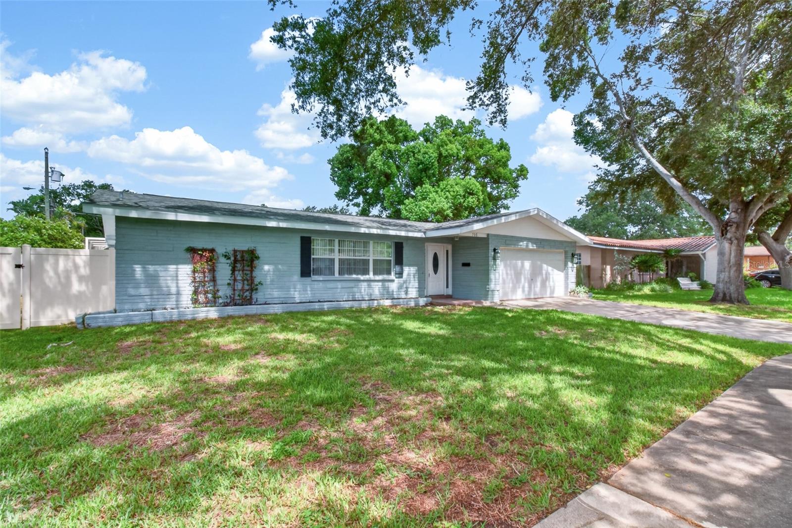 Welcome home to this beautifully maintained 4-bedroom, 2-bathroom pool home located in the heart of Clearwater! Offering the perfect blend of comfort, style, and convenience, this home is move-in ready and ideal for both everyday living and entertaining.Step inside to a welcoming foyer with a spacious closet ,which opens to a bright and inviting open floor plan featuring newer flooring throughout, fresh interior paint, and an updated kitchen with stainless steel appliances. The spacious bedrooms offer oversized closets, providing plenty of storage and flexibility for family, guests, or a home office.One of the standout features of this home is the light-filled Florida room with wraparound windows overlooking the sparkling in-ground pool. Just beyond, the screened-in patio creates the perfect setting for outdoor dining and relaxation. With newer sliding glass doors providing access from multiple rooms, this inviting space seamlessly blends indoor and outdoor living.The fully fenced backyard offers privacy and plenty of space to enjoy the Florida lifestyle.Located 1 mile from the Clearwater Threshers stadium, this home is a fantastic opportunity for baseball fans and anyone looking to enjoy the area’s vibrant atmosphere. You’ll also appreciate the convenient proximity to schools, shopping, dining, parks, and public safety facilities. Clearwater’s world-famous beaches, waterfront activities, and entertainment options are just a short drive away.With strong curb appeal, generous living spaces, and valuable updates already completed, this home is ready for its next owner. Schedule your private showing today and see all that this Clearwater gem has to offer!