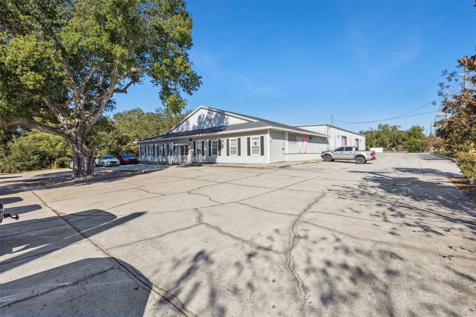 COMMERCIAL with DIRECT HWY. 50 FRONTAGE located in Oakland. ONLY 1/2 mile from the FLORIDA TURNPIKE NORTH AND SOUTH RAMPS! CORNER location at SIGNAL on HIGHWAY 50. The building has a showroom measuring  approximately 39x61, ten  offices, conference room, media room, show room and  two restrooms (total 3200 sf) WAREHOUSE, is free span with THREE roll up doors.  TOTAL building combined building size is 11,200 sf. This property is located in Oakland and has MANY permitted uses for C-1 zoning (see attachment of list of possibilities).