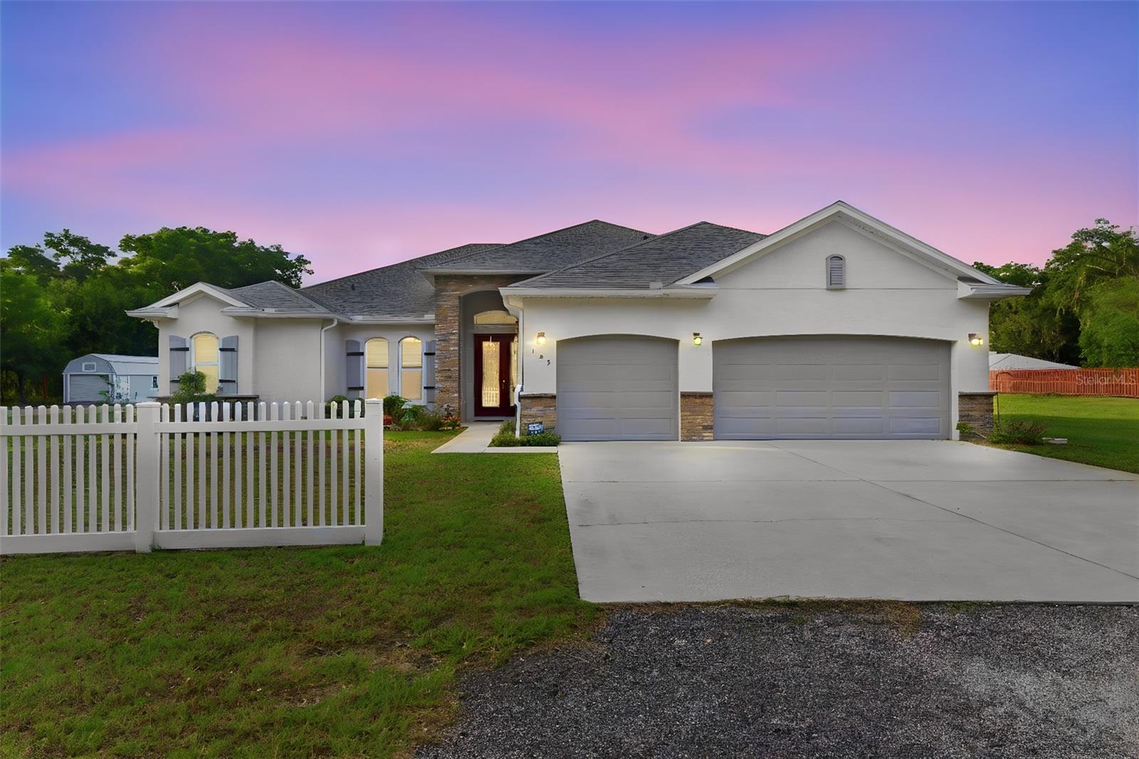 One or more photo(s) has been virtually staged. Semi-Custom built home from local builder Gallery Homes of Deland. Home sits on mostly cleared 3.72 acres. the homes has 4 bedrooms with 3 baths, office and formal Dining Room. You have an open concept with the living-room and custom kitchen. Solid wood cabinets, quarts counter tops, gas stove, island with seating and plenty of storage. The primary bedroom is spacious with on-suite dual vanity, make-up area, walk in shower. There are 3 bedrooms and 2 baths on other side of home. Through the french doors off the living room is a enclosed porch that is 645 sqft under air. The home also offers a full generator, well, water softner, tankless hot water heater and solar panels that keep your bills low. Outside there is a fence to keep your fur baby's safe. There are  (2) 32ft long storage shed  Maybe you need something bigger It also has a 2000sqft workshop that has electricity and plumbing. There is a lift and air compressor inside. Two roll up doors one for an RV. Perfect for all the work trucks. Don't miss out on this opportunity, call today to view the home.